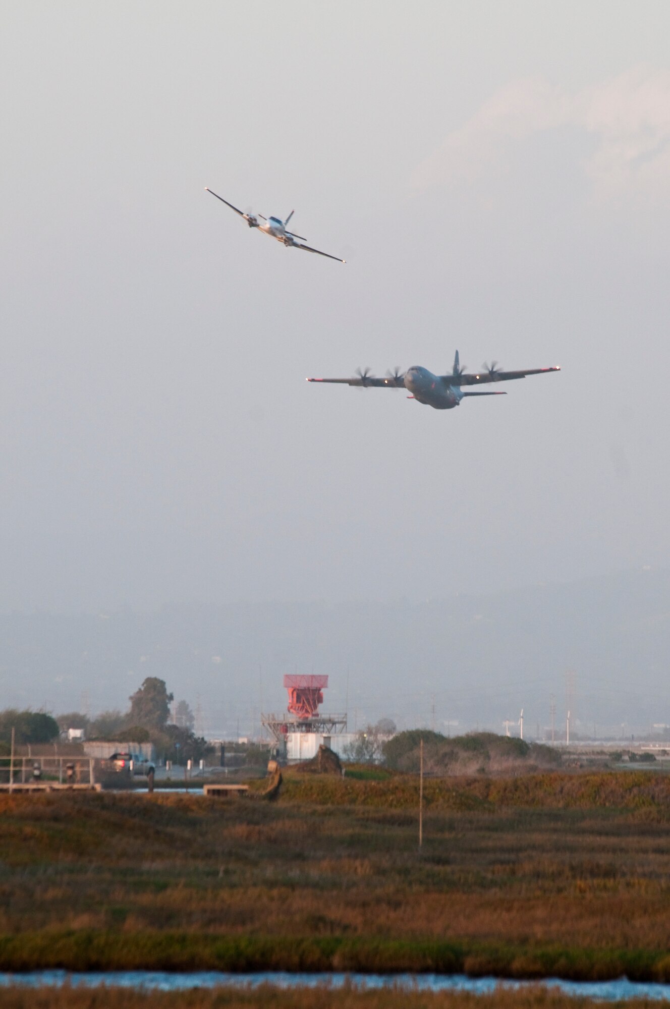 A C130J from the 146th Airlift Wing performs a MAFFS (Modular Airborn Firefighting Systems) water drop near Point Mugu during MAFFS recertification and training March 6, 2012. (AF photo by Senior Airman Nic Carzis) 
 
