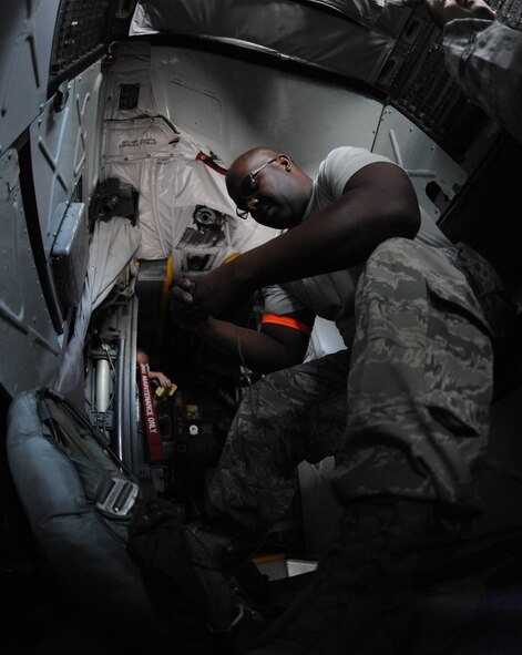 Tech. Sgt. Brian Harvey, 2nd Operation Support Squadron aircrew flight equipment, inspects a parachute inside a B-52H Stratofortress on Barksdale Air Force Base, La., March 6. Parachutes are placed in key locations around the aircraft for personnel to use in the event of an emergency. (U.S. Air Force photo/Airman 1st Class Micaiah Anthony)(RELEASED)