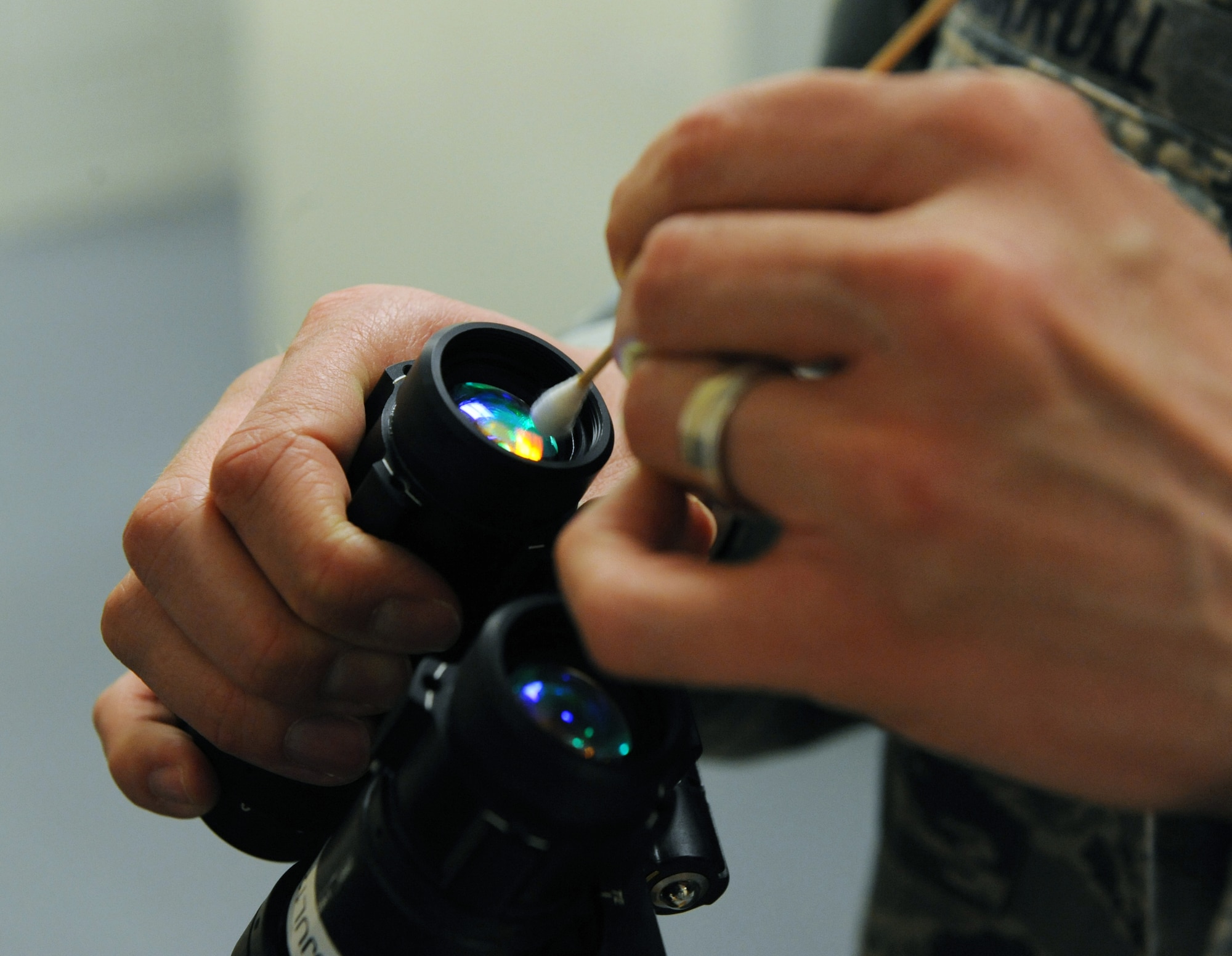 Tech. Sgt. William Carroll III, 2nd Operation Support Squadron aircrew flight equipment, cleans a pair of night vision goggles on Barksdale Air Force Base, La., March 6. NVGs are cleaned and inspected after every use to ensure aircrew members have fully functional equipment when they need it. (U.S. Air Force photo/Airman 1st Class Micaiah Anthony)(RELEASED