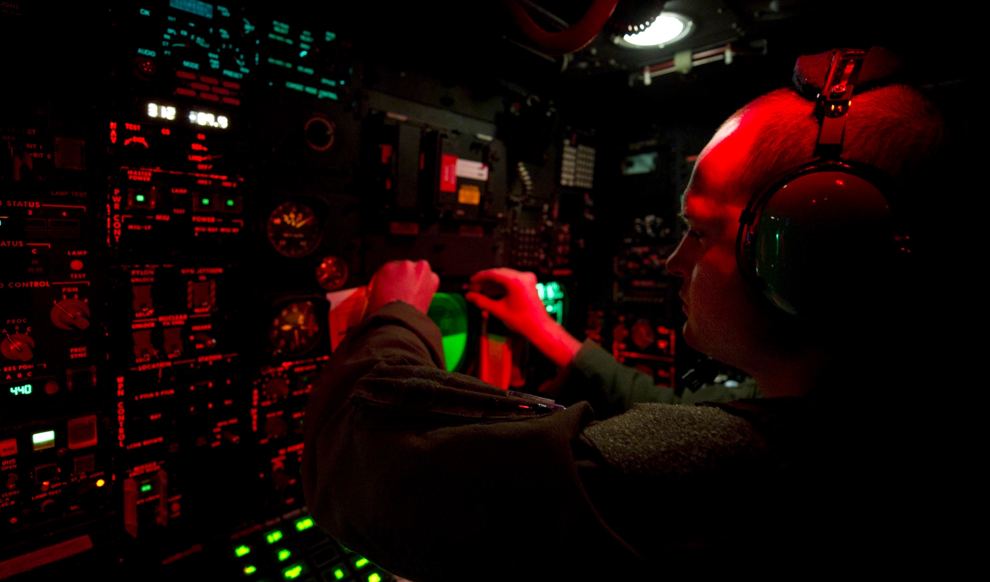 B-52H Stratofortress navigator 1st Lt. Mason Martin, 96th Bomb Squadron, Barksdale Air Force Base, La., runs a checklist during Exercise Red Flag, March 3, 2012. Red Flag trains pilots from the U.S., NATO and other allied countries for realistic combat scenarios. The B-52 performs a dual-role mission, nuclear and conventional, providing a rapid global strike capability and ability to reach hardened and buried targets anywhere and at anytime.  (U.S. Air Force photo by Tech. Sgt. Bradley C. Church)(Released)
 