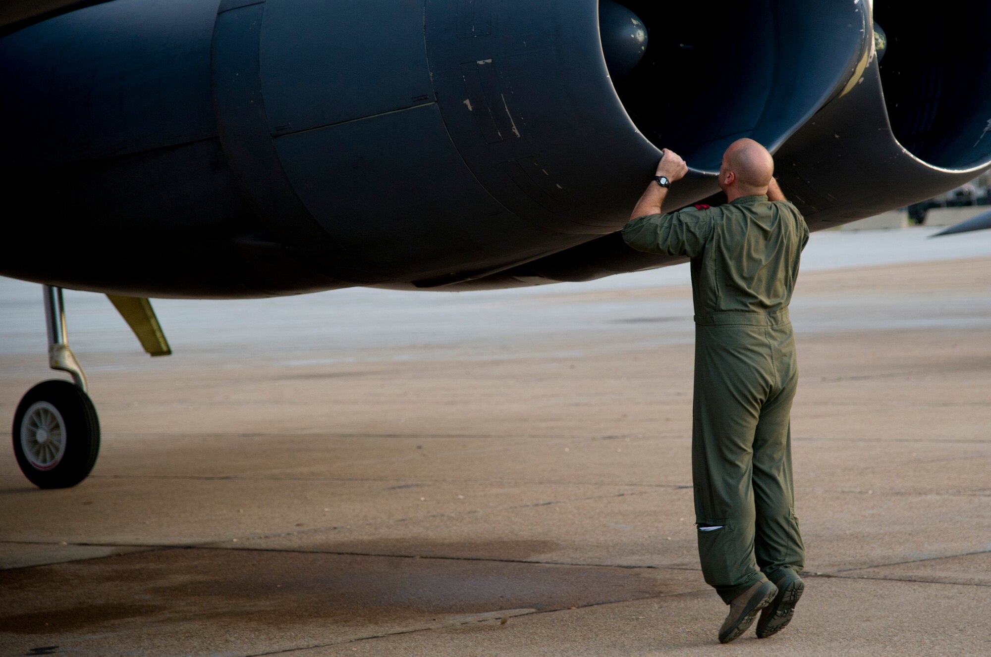 Capt. Michael Plourde, a B-52H Stratofortress pilot from the 96th Bomb Squadron, Barksdale Air Force Base, La., checks the engines before a flight during Exercise Red Flag, March 3, 2012. Red Flag trains pilots from the U.S., NATO and other allied countries for realistic combat scenarios. The exercise provides an opportunity for Air Force Global Strike Command units to demonstrate conventional strike capability, anytime and anywhere. (U.S. Air Force photo by Tech. Sgt. Bradley C. Church) (Released)
