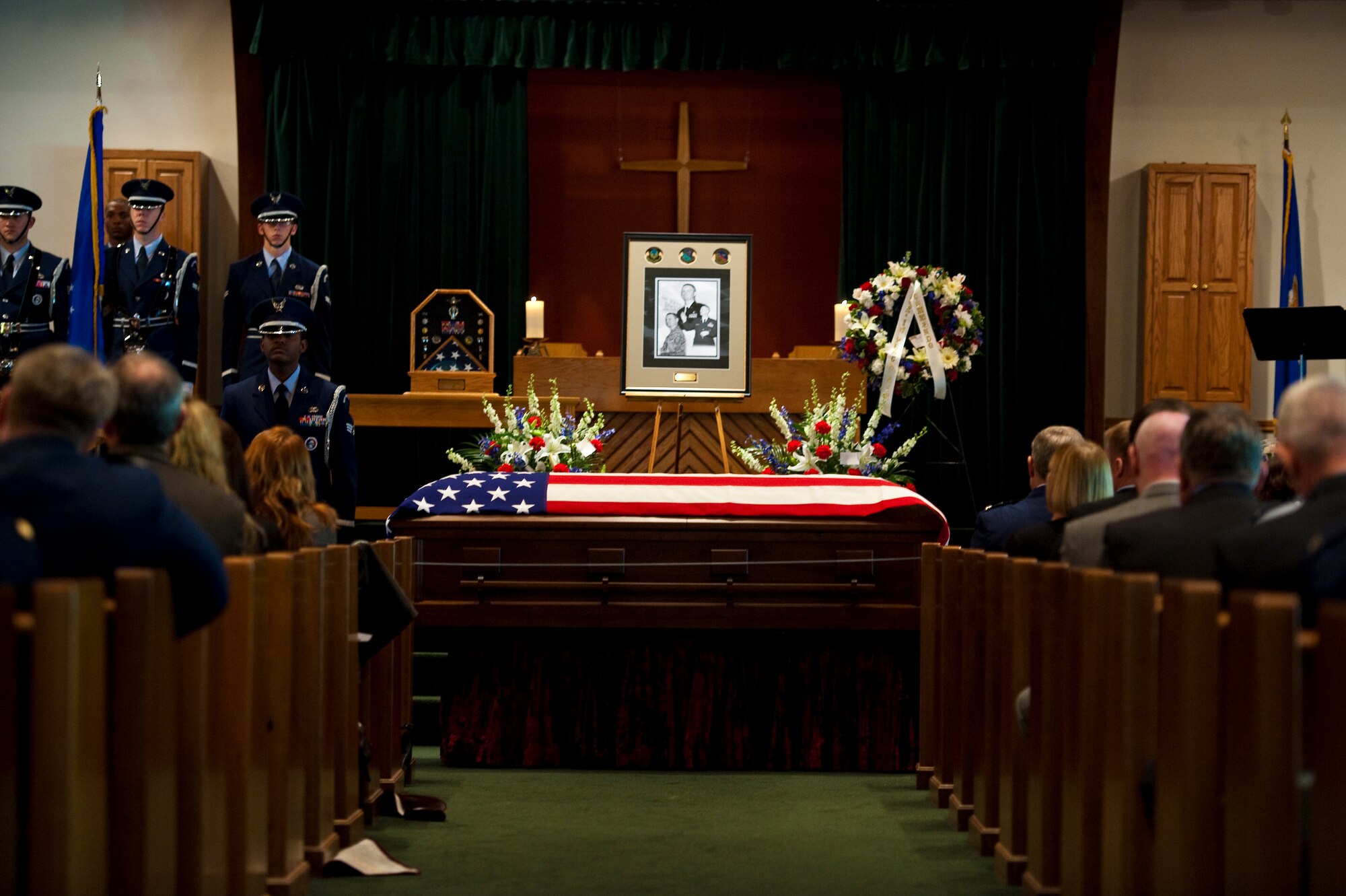 Approximately 250 family, friends and Airmen from across the Air Force attend Lt. Col. John Darin Loftis?s funeral Monday, Mar. 5, 2012, at the base chapel on Hurlburt Field, Fla. Loftis died Feb. 25 from wounds received during an attack at the Interior Ministry, Kabul, Afghanistan. (U.S. Air Force photo by/Airman 1st Class Christopher Williams.)