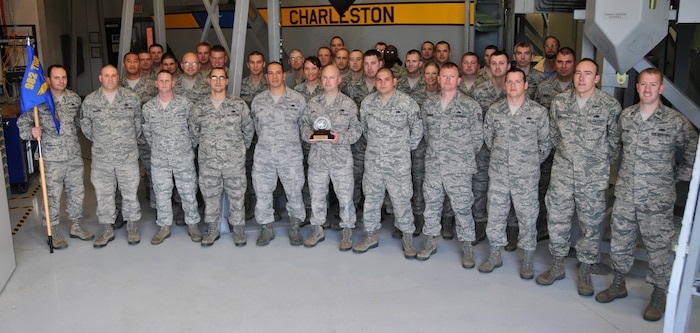 Members of the 373rd Training Squadron Detachment 5 pose for a group photo March 7, 2012, at Joint Base Charleston after receiving the John F. Entrican award for being the detachment of the year. Each year, the John F. Entrican award is presented to one of the 47 detachments in the 982nd Training Group. (U.S. Air Force photo/Airman 1st Class Jared Trimarchi) 