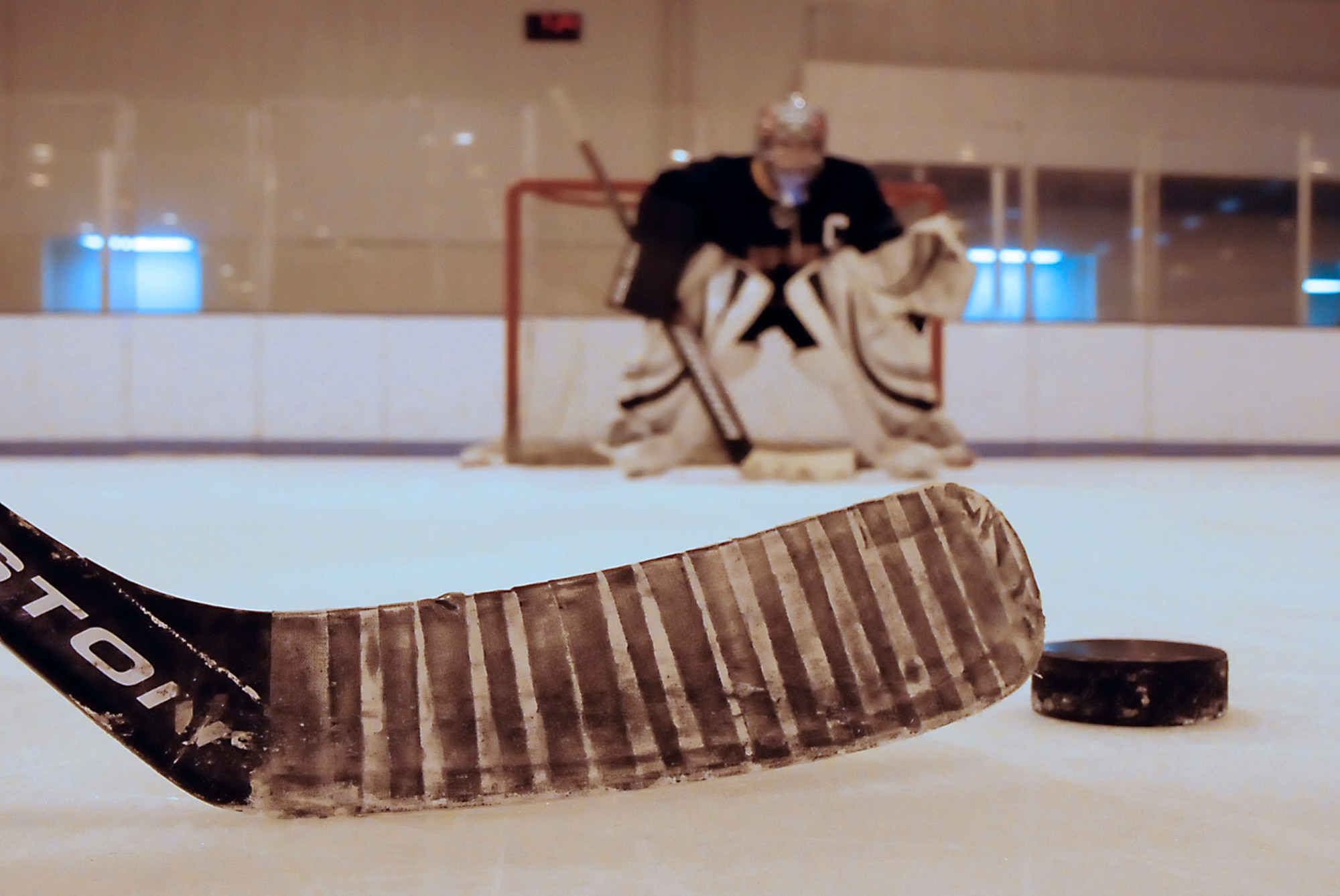 U.S. Air Force Staff Sgt. Jeffery Jones, Eielson Icemen goalie, prepares to block a slap shot at a practice session March 1, 2012, at Polar Ice Center Ice Skating Rink, Fairbanks, Alaska. Jones, a 354th Maintenance Squadron aircraft maintenance scheduler, has been playing hockey for two years while stationed at Eielson Air Force Base. (U.S. Air Force photo/Airman 1st Class Zachary Perras) 