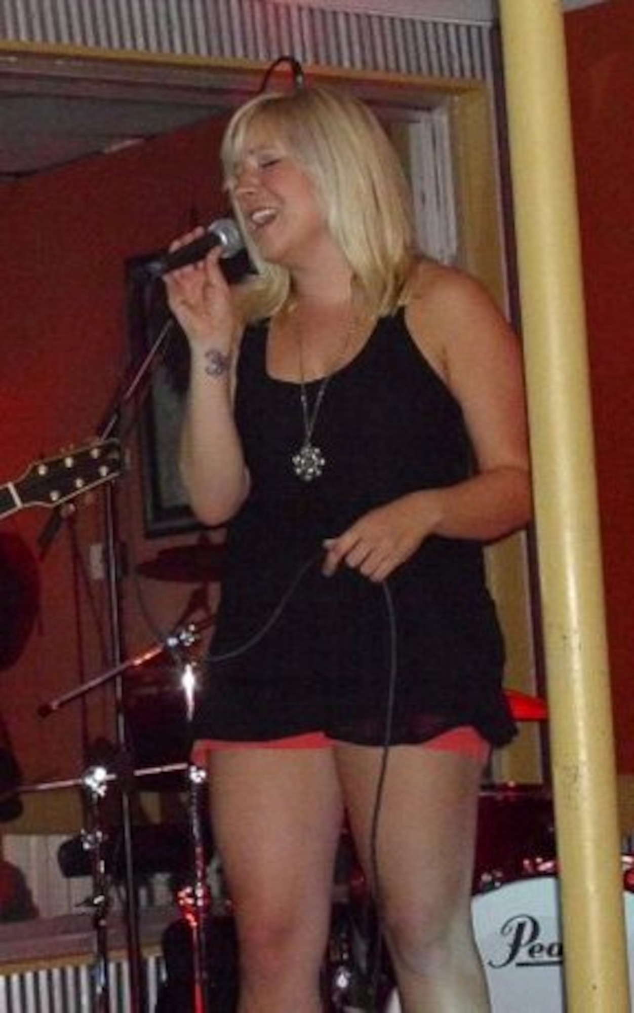 Staff Sgt. Brittnie Baxter, 53rd Weapons Evaluation Group knowledge operations manager, performs at a local venue. (U.S. Air Force courtesy photo)