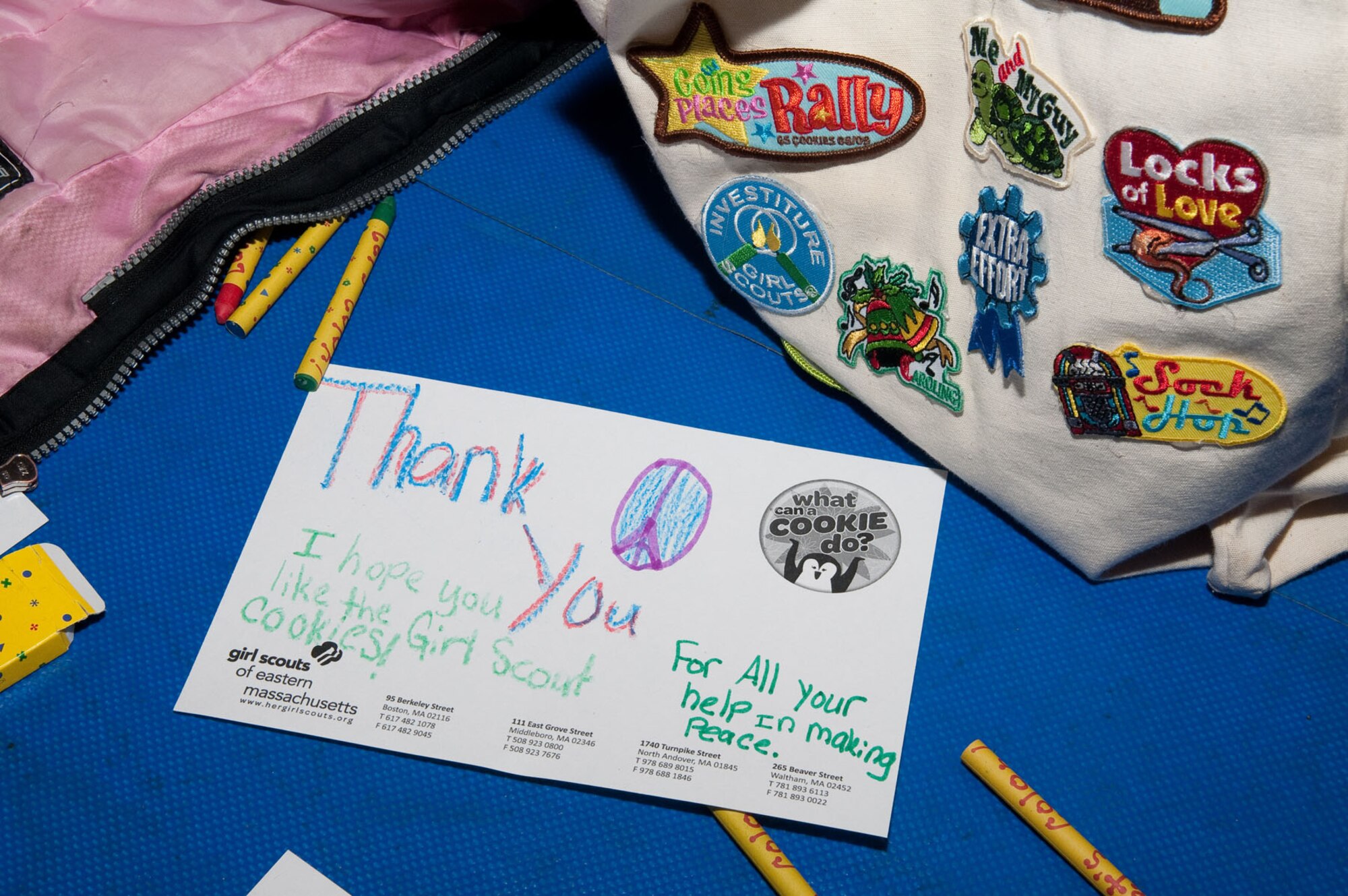 HANSCOM AIR FORCE BASE, Mass. – A letter to the troops is ready to be sent during Operation Cookie Drop at the Tennis Bubble March 3. After 30,000 boxes were distributed to troop-focused organizations, approximately 1,000 Girl Scouts huddled together to hear from leaders, sing songs and write letters to troops. (U.S. Air Force photo  by Walter Santos) 