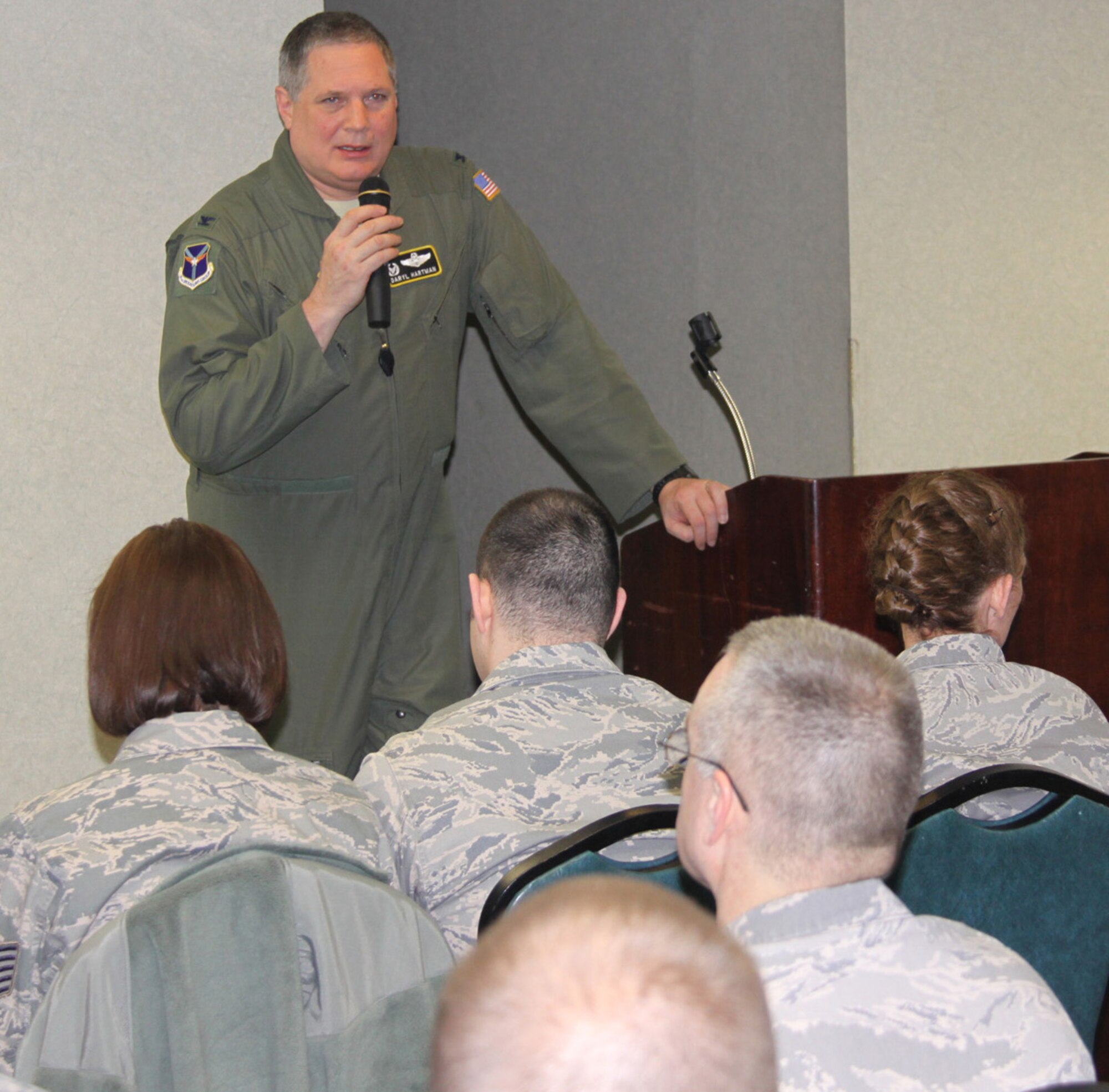 Col. Daryl Hartman, commander, 911th Operations Group, briefs members of the 911th Airlift Wing March 7, 2012 after the recent release of the Air Force manpower force structure announcement. “We will continue to do our mission and that is the most important thing,” said Hartman. “We will do the excellent job we always have in the Air Force Reserve Command.” Col. Hartman relayed the information released on March 6, 2012 about the change in manpower for the 911th in which the wing is scheduled for deactivation. (U.S. Air Force photo/Master Sgt. Mark Winklosky/Released)