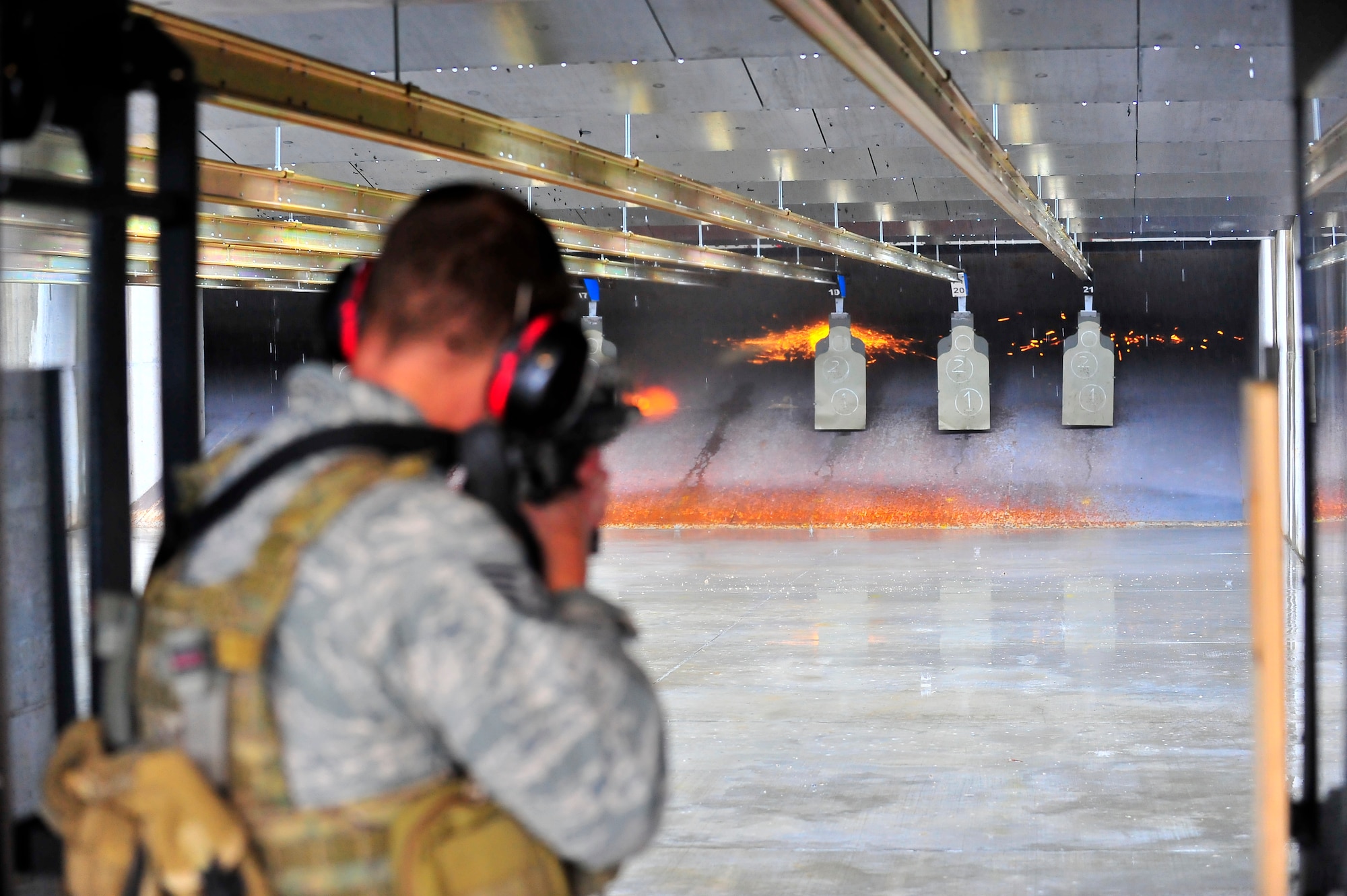 An Airman shoots his target at the firing range on Shaw Air Force Base, S.C. Feb. 27, 2012. There is an average of 14 to 18 individuals per class and three to five classes a week. The combat arms maintenance and training course lasts from 8 a.m. to 5:30 p.m. and trains between 3,000 – 4,500 Airmen per year. (U.S. Air Force photo by Senior Airman Neil D. Warner/Released)