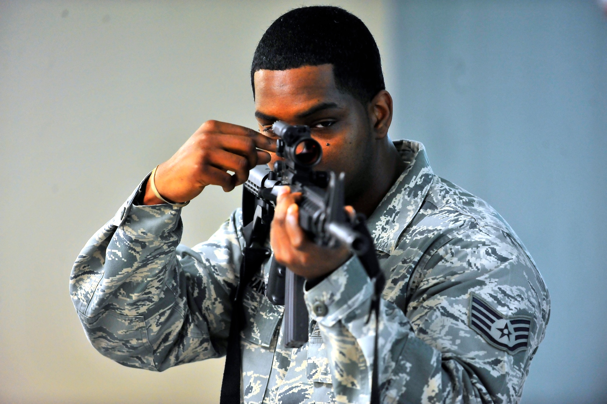 U.S. Air Force Staff Sgt. Norman Charlton, 20th Security Forces Squadron combat arms maintenance and training instructor, demonstrates adjusting the rear sight of a M4A2 assault rifle on Shaw Air Force Base, S.C. Feb. 27, 2012. Airmen attending the CATM course learn how to properly disassemble, clean and use proper shooting techniques. (U.S. Air Force photo by Senior Airman Neil D. Warner/Released)