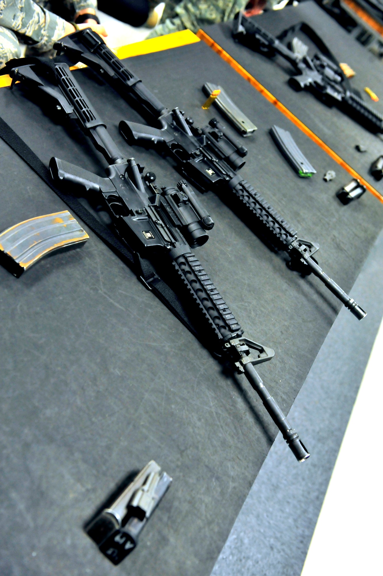 M4A2 assault rifles are displayed on the classroom work benches at Shaw Air Force Base, S.C. Feb. 27, 2012. Airmen attending the combat arms maintenance and training course learn how to properly disassemble, clean and use proper shooting techniques. (U.S. Air Force photo by Senior Airman Neil D. Warner/Released)