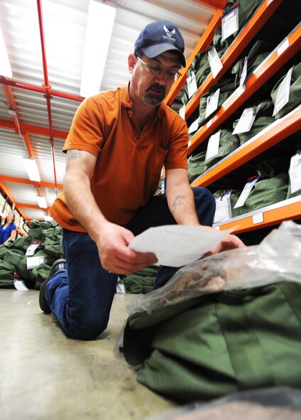 John Guinther, 20th Logistics Readiness Squadron material handler, checks over the equipment in each A-bag to make sure it hasn?t expired its shelf life during the Sea Lion exercise at Shaw Air Force Base, S.C., March 6, 2012. An Operation Readiness Exercise prepares and gives Airmen the chance to experience how the processing line and operation works if they were to deploy. (U.S. Air Force photo by Senior Airman Tabatha McCarthy/released)