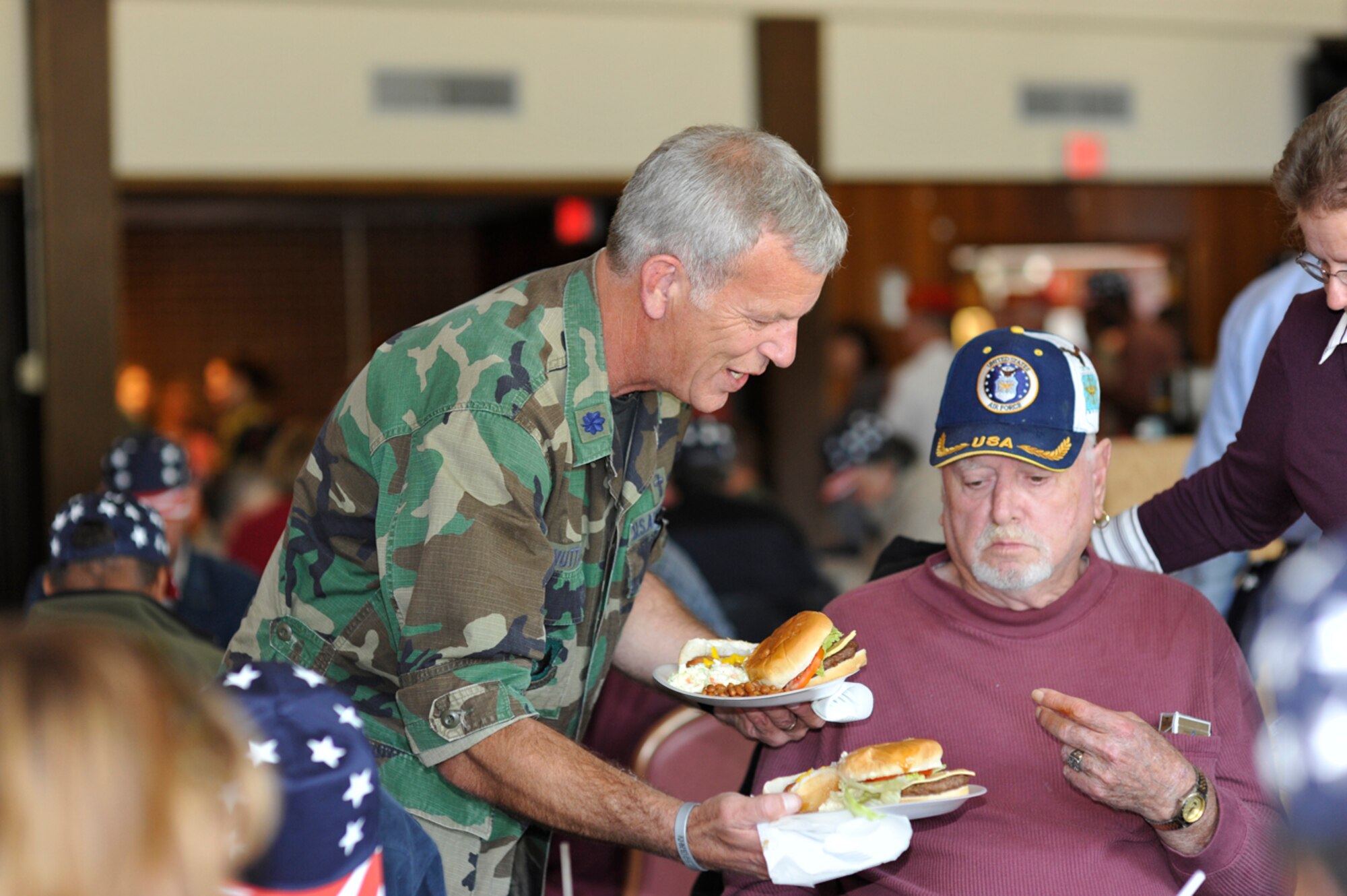 Chaplain Nutter helps serve food at an annual Veterans’ Picnic at the Arnold Lakeside Center (ALC). (Photo by Rick Goodfriend)