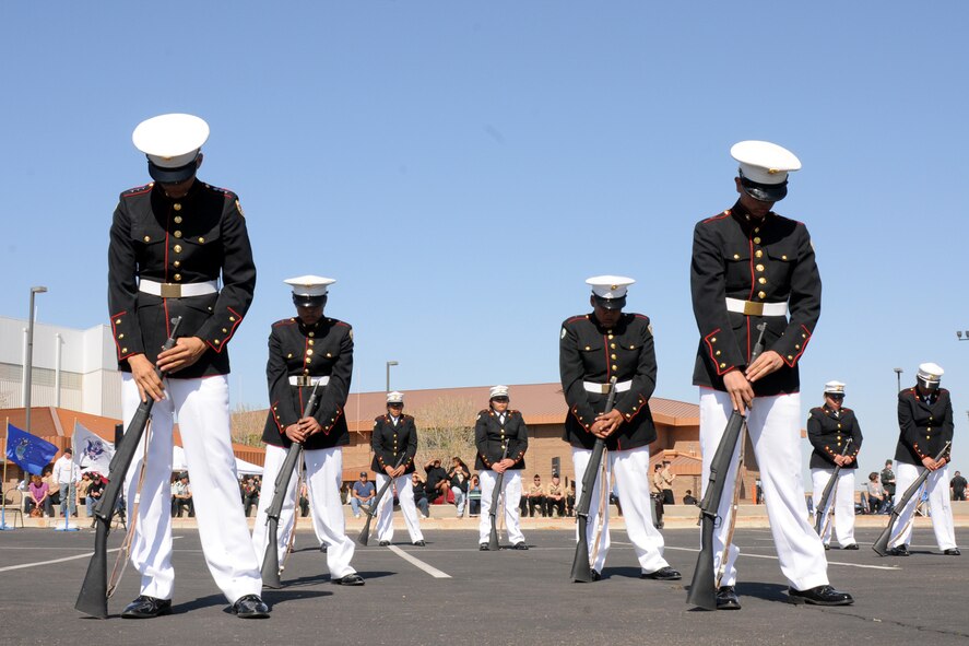 Junior Reserve Officers' Training Corp Cadets compete in the 10-man armed category at the West Mitchell Drill invitational Drill meet Feb.18, 2012, at the 161st Air Refueling Wing, Phoenix. This is the 12th annual event and was hosted by members of the Sons of the American Legion Post One. (Photo by Airman 1st Class Rashaunda Williams/Released)