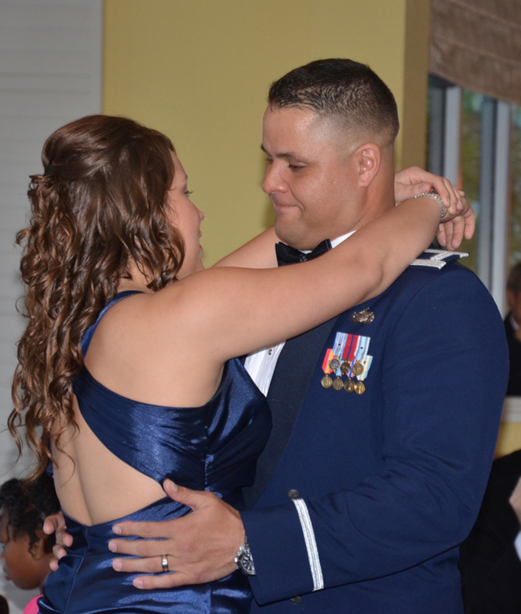 Capt. Paul Hayes, 920th Rescue Wing military equal opportunity officer, dances with his daughter on his wedding day Feb. 29 at a Florida beachfront hotel. The wedding cost Hayes nothing because nineteen local vendors sponsored their wedding. The sponsorship was offered to a local military couple and fit the couple's monetary needs perfectly as they are both full time doctoral students. The wedding was valued at $12,000. (U.S. Air Force photo/Capt. Cathleen Snow)