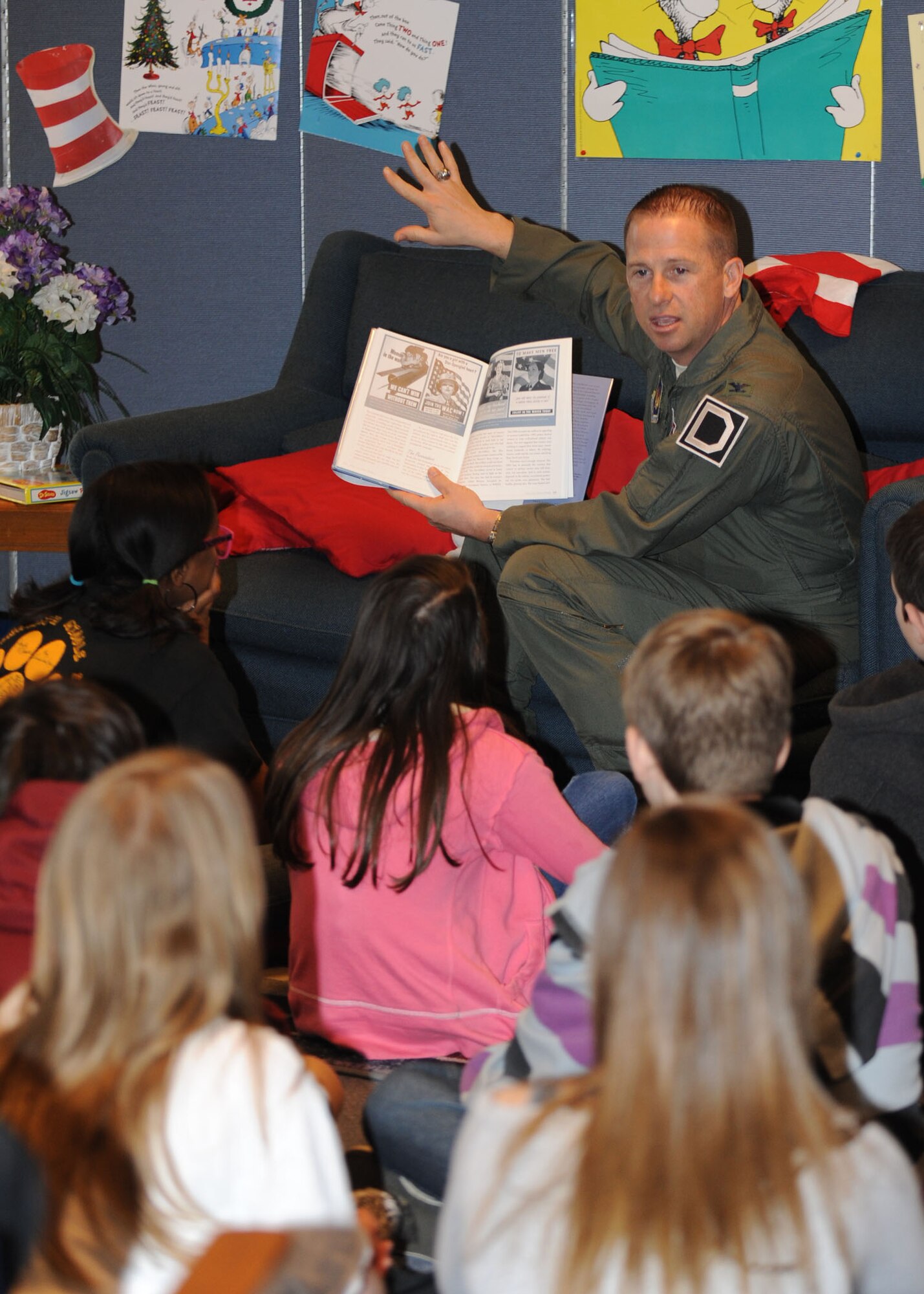 RAF FELTWELL, England – Col. Kyle Voigt, 100th Air Refueling Wing vice commander, reads to students at Lakenheath Middle School on RAF Feltwell March 2, 2012. Voigt was at the school as one of several guest readers for Read Across America Day. (U.S. Air Force photo/Tech. Sgt. Neal X. Joiner) 