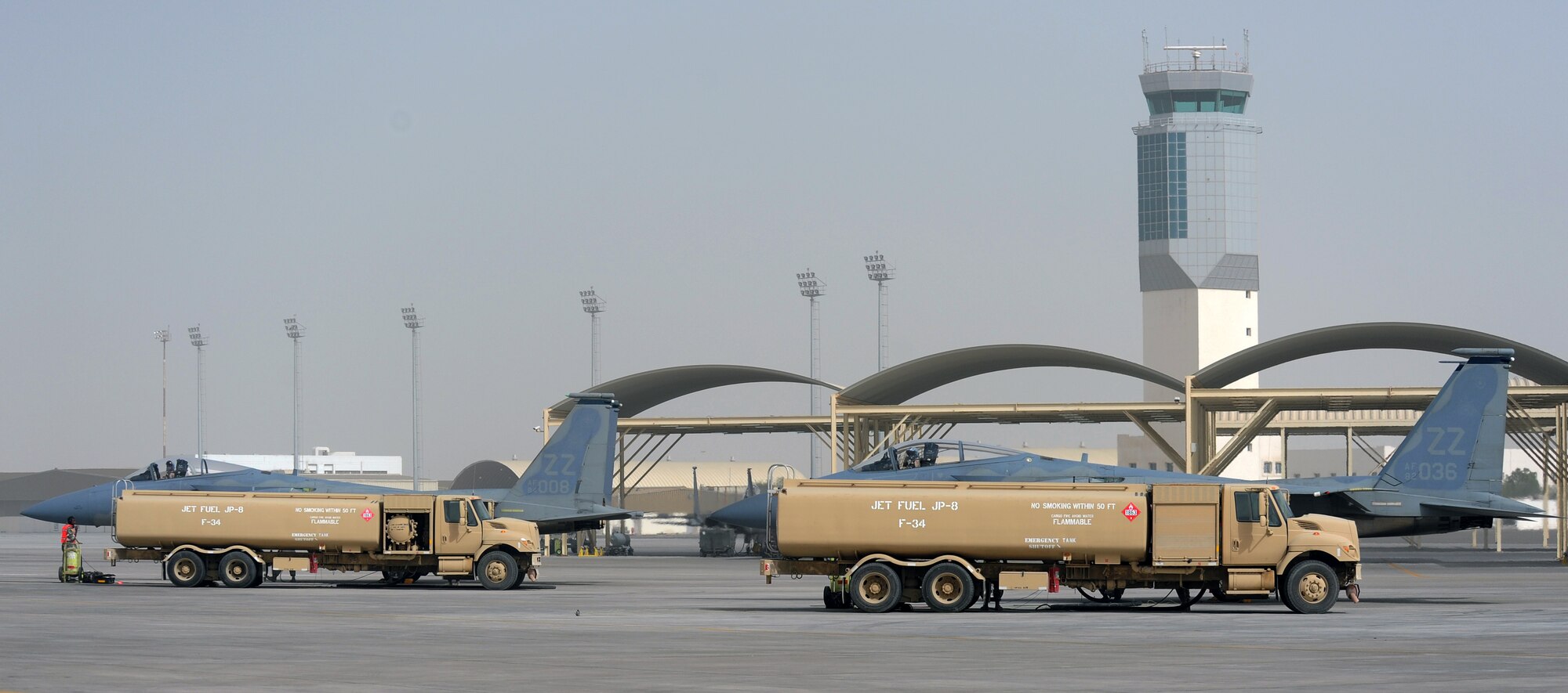 SOUTHWEST ASIA - Airmen at the 380th Air Expeditionary Wing refuel an F-15 Eagle between sorties using hot pits. Fuels specialists partner with weapons and maintenance experts to top off the tanks, all while the pilot keeps one of the engines running. The process means pilots can take to the air faster, saving maintainers the 90 minutes it would take to prepare another jet. (U.S. Air Force photo/Staff Sgt. J.G. Buzanowski)