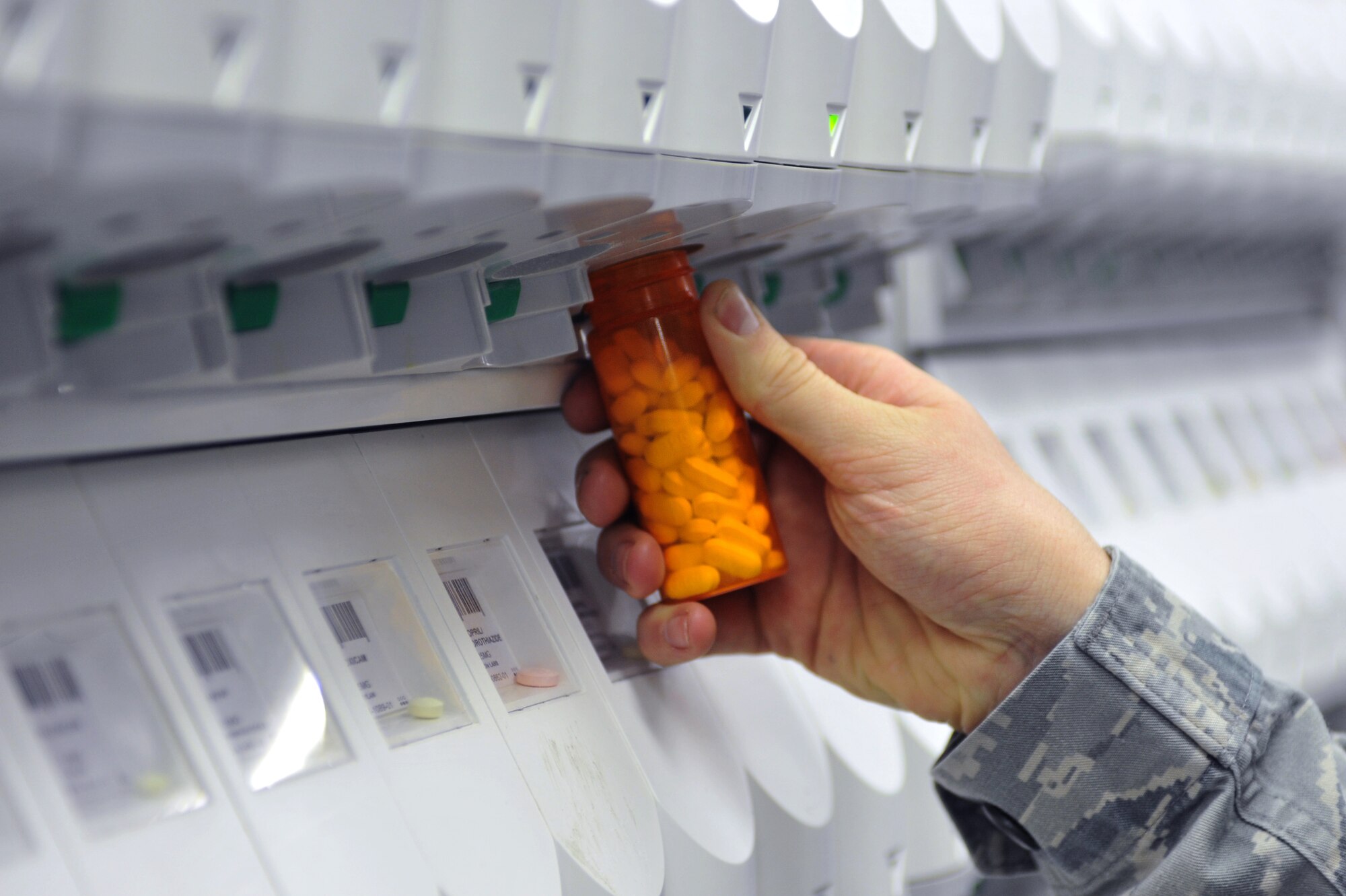 U.S. Air Force Senior Airman Ronald Bishop, 86th Medical Group pharmacy technician, counts pills while filling prescriptions for military members and retirees, Ramstein Air Base, Germany, March 6, 2012. The 86th Medical Group Pharmacy fills 400 prescriptions any normal duty day to include a variety of medication and requested special orders. (U.S. Air Force photo/Airman 1st Class Caitlin O'Neil-McKeown)