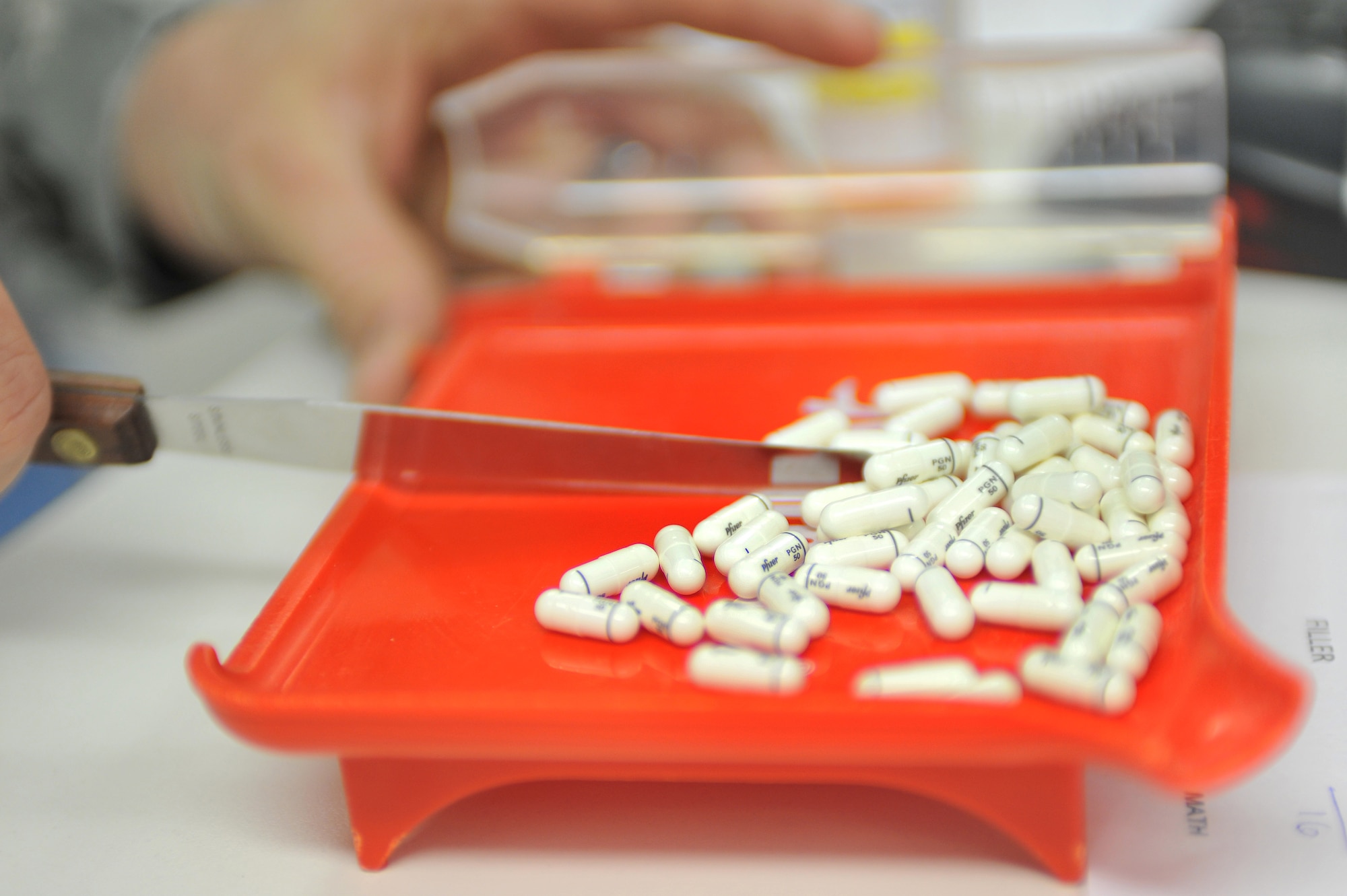 U.S. Air Force Senior Airman Ronald Bishop, 86th Medical Group pharmacy technician, counts pills while filling prescriptions for military members and retirees, Ramstein Air Base, Germany, March 6, 2012. The 86th Medical Group Pharmacy fills 400 prescriptions any normal duty day to include a variety of medication and requested special orders. (U.S. Air Force photo/Airman 1st Class Caitlin O?Neil-McKeown)
