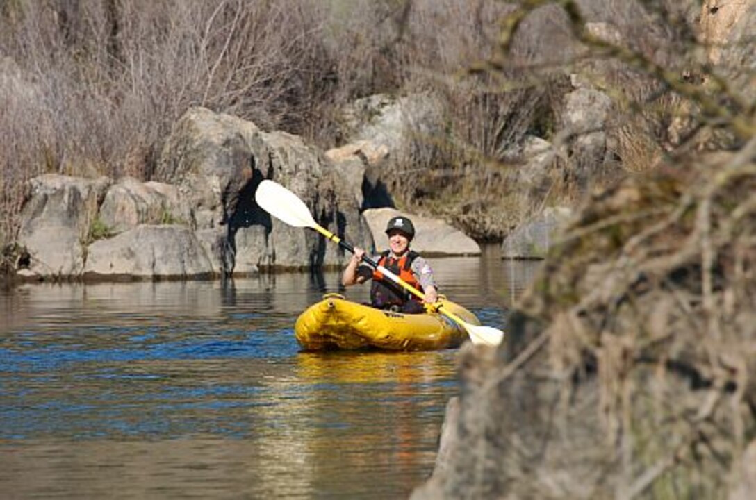 STANISLAUS RIVER PARKS, Calif. -- Heather Wright, U.S. Army Corps of Engineers Ranger, paddles along a quiet reach of the Stanislaus River.