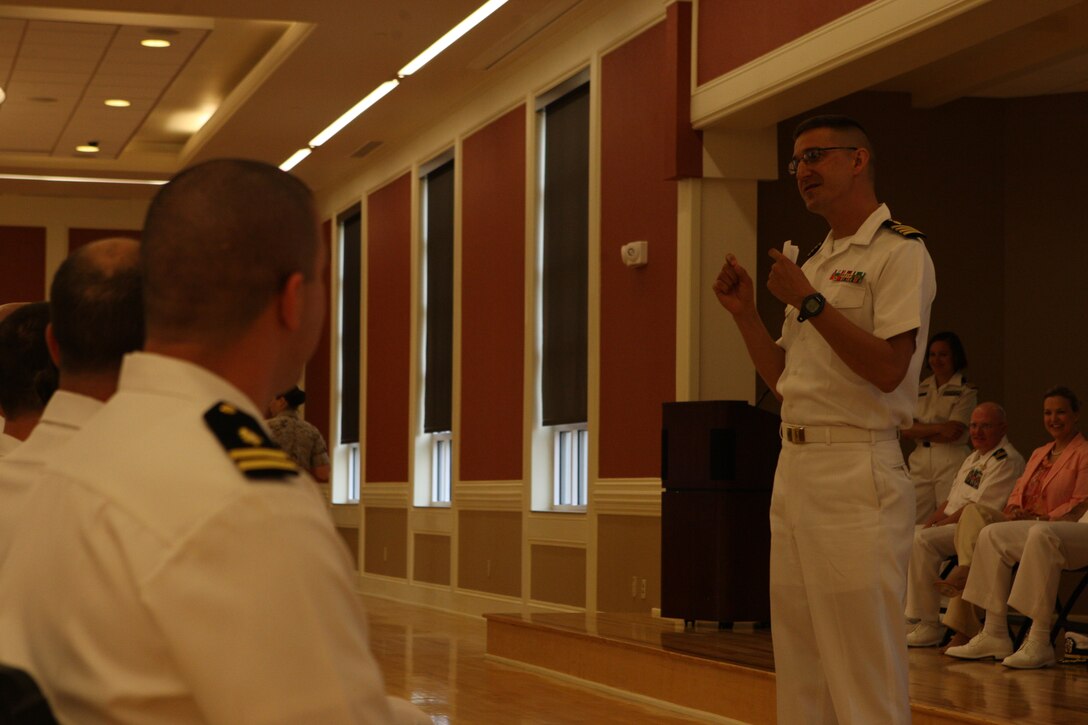 Navy Capt. Mark Stephens, associate professor and chair of the Department of Family Medicine, Uniformed Services University of the Health Sciences, speaks to Naval Hospital Camp Lejeune interns and residents during the Family Medicine Residency program graduation at Marston Pavilion aboard Marine Corps Base Camp Lejeune, July 1. The 13 graduating sailors are destined to either continue their training at the hospital or check in at their first duty station as new medical practitioners.