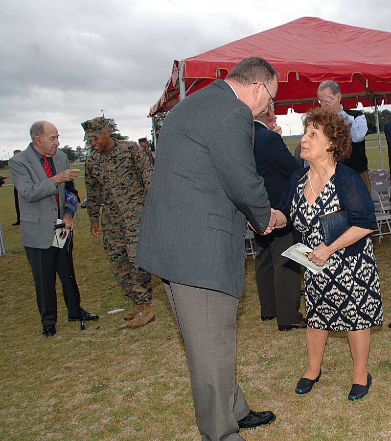 Kent Morrison, executive director, Marine Corps Logistics Base Albany, talks with Mary Deiter, the wife of Karl Deiter, who was the first Marine stationed in Albany.