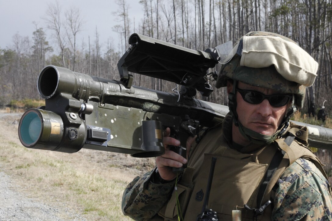 Gunnery Sgt. Robert B. Reed, the Battery A 2nd Low Altitude Air Defense Battalion First Sergeant, demonstrates proper handling techniques for the Stinger Missile during Exercise Sandman at the Air Force Dare County Bombing Range Mar. 8. "You never know what could happen in an actual combat environment. There could come a time when they might have to put a missile on their shoulder and fire it,” said Capt. Leonard J. Niedosik, the Battery A 2nd Low Altitude Air Defense Battalion commanding officer.