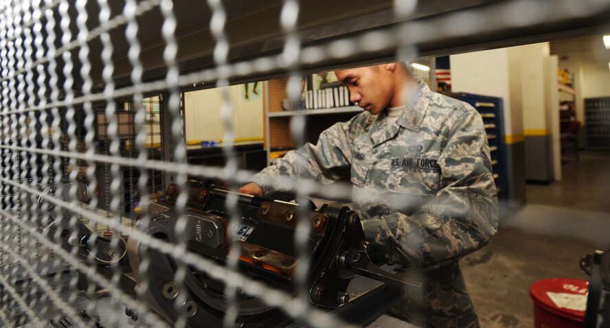 U.S. Air Force Senior Airman Florante Tababa, 14th Aircraft Maintenance Unit support section technician, inspects a one-step loading adapter at Misawa Air Base, Japan, Jan. 24, 2012. Tababa inspected the adapter for damaged pins, corrosion, free-moving parts, identification numbers and markings. (U.S. Air Force photo by Airman Kenna Jackson/Released)