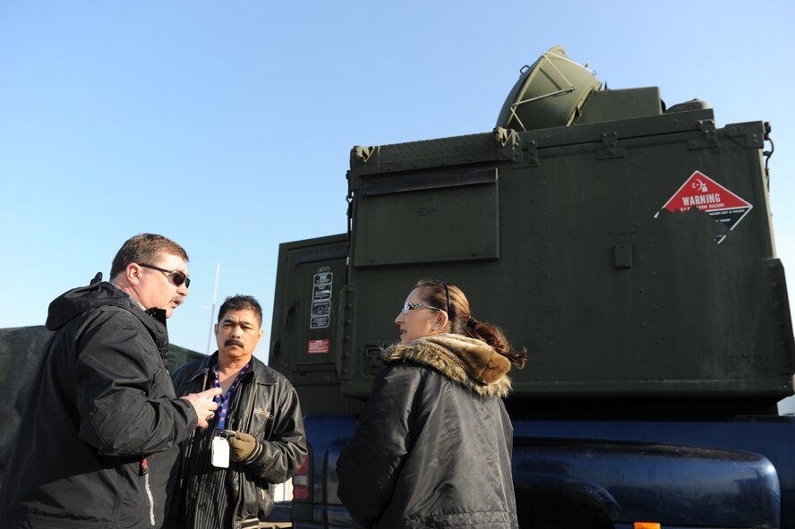 KONYA, Turkey – Lance Geyer, Polygone quality assurance inspector, gives a mission brief to Jose DeRama and Dominga Perry, both Polygone radar operators, before leaving for a mission during Anatolian Falcon 2012 in Konya, Turkey, March 8. Polygone operated tactical radar threat generators throughout the exercise to provide a simulated enemy ground threat capability to the participating aircraft. (U.S. Air Force photo/Staff Sgt. Benjamin Wilson)