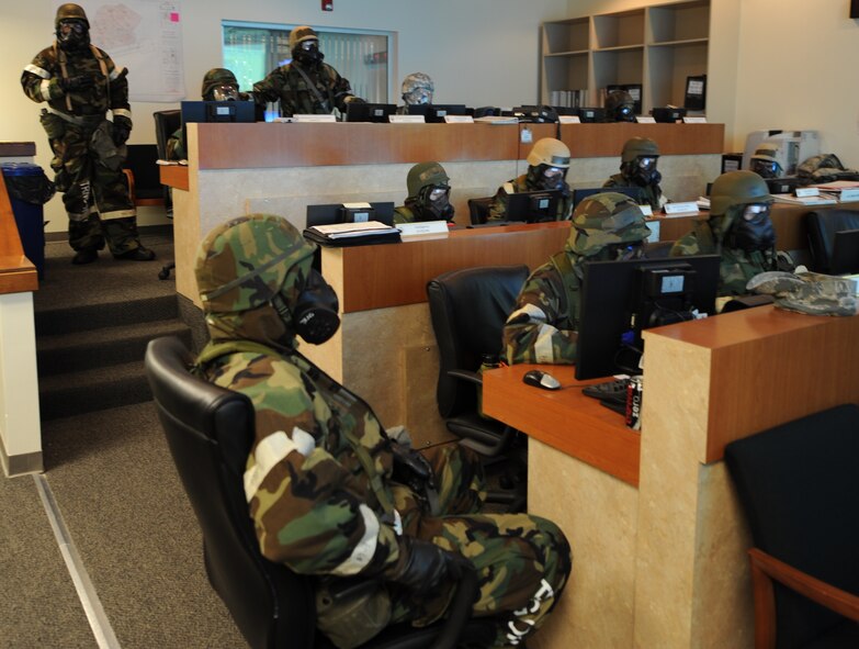 Members of the 4th Fighter Wing Commander's Action Team convene during a phase II Operational Readiness Exercise  on Seymour Johnson Air Force Base, N.C., Mar. 8, 2012. The CAT is comprised of representatives from operations, maintenance, medical, mission support and the commander's staff and acts as a leadership cell during exercise and real world incidents. (U.S. Air Force photo/Airman 1st Class Mariah Tolbert/Released)