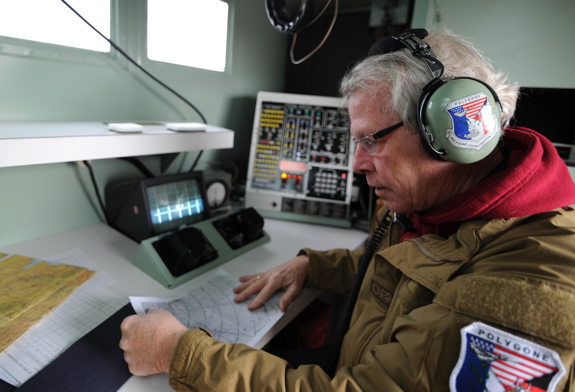 KONYA, Turkey – Jack Graham, Polygone radar technician, reviews a map of the surrounding area inside a tactical radar threat generator during Anatolian Falcon 2012 in Konya, Turkey, March 8. Graham operated the radar, tracking participating aircraft in the exercise, to provide a simulated ground threat capability. (U.S. Air Force photo/Staff Sgt. Benjamin Wilson)