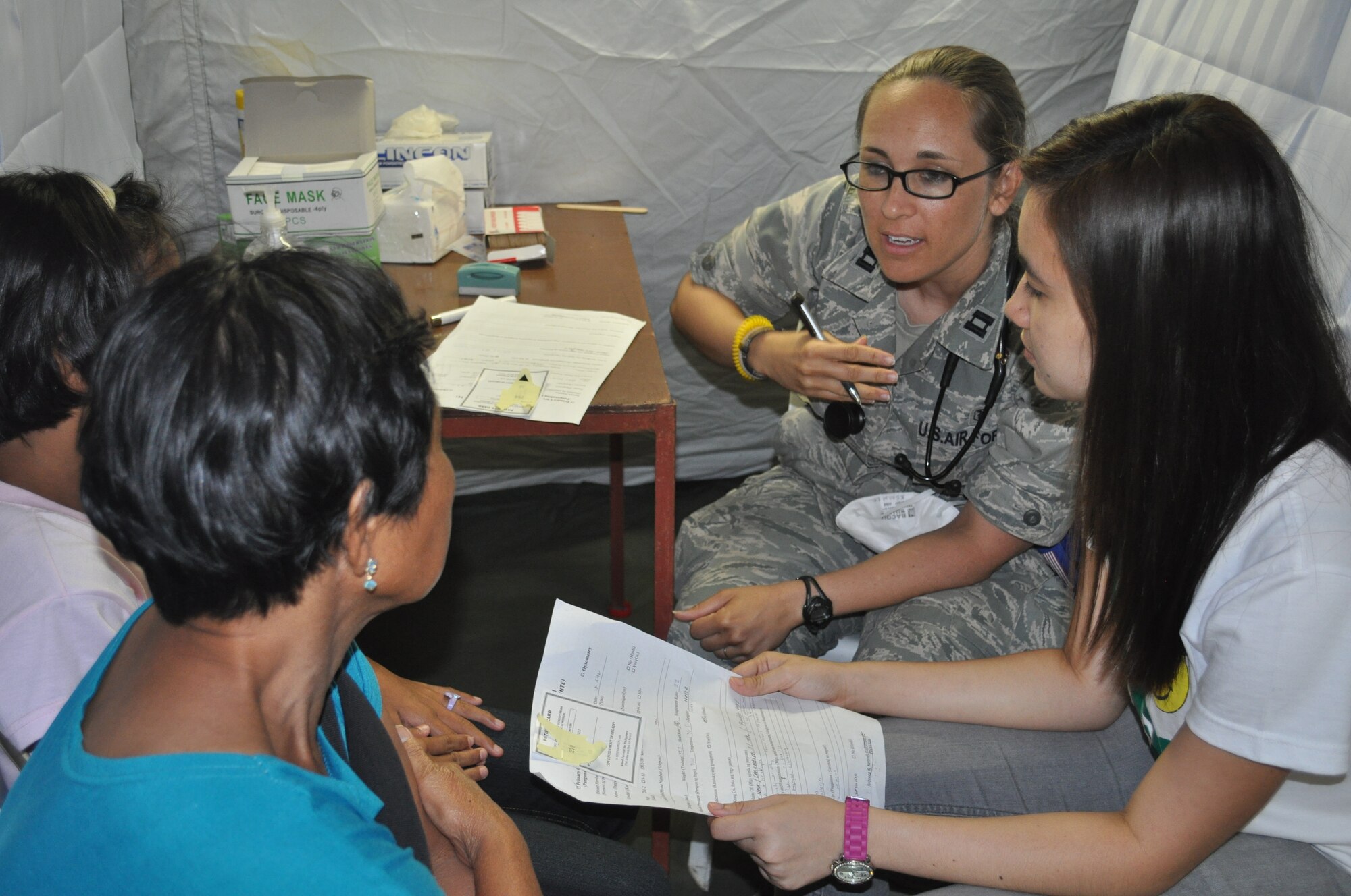 Capt. Rebecca Kemmet, 36th Medical Operations Squadron flight physician from Andersen Air Force Base, Guam, discusses care with a patient March 5, 2012 during Operation Pacific Angel-Philippines. PACANGEL is a joint and combined humanitarian operation led by 13th Air Force. It is scheduled to run through March 10. (U.S. Air Force photo/Master Sgt. Allison Day)
