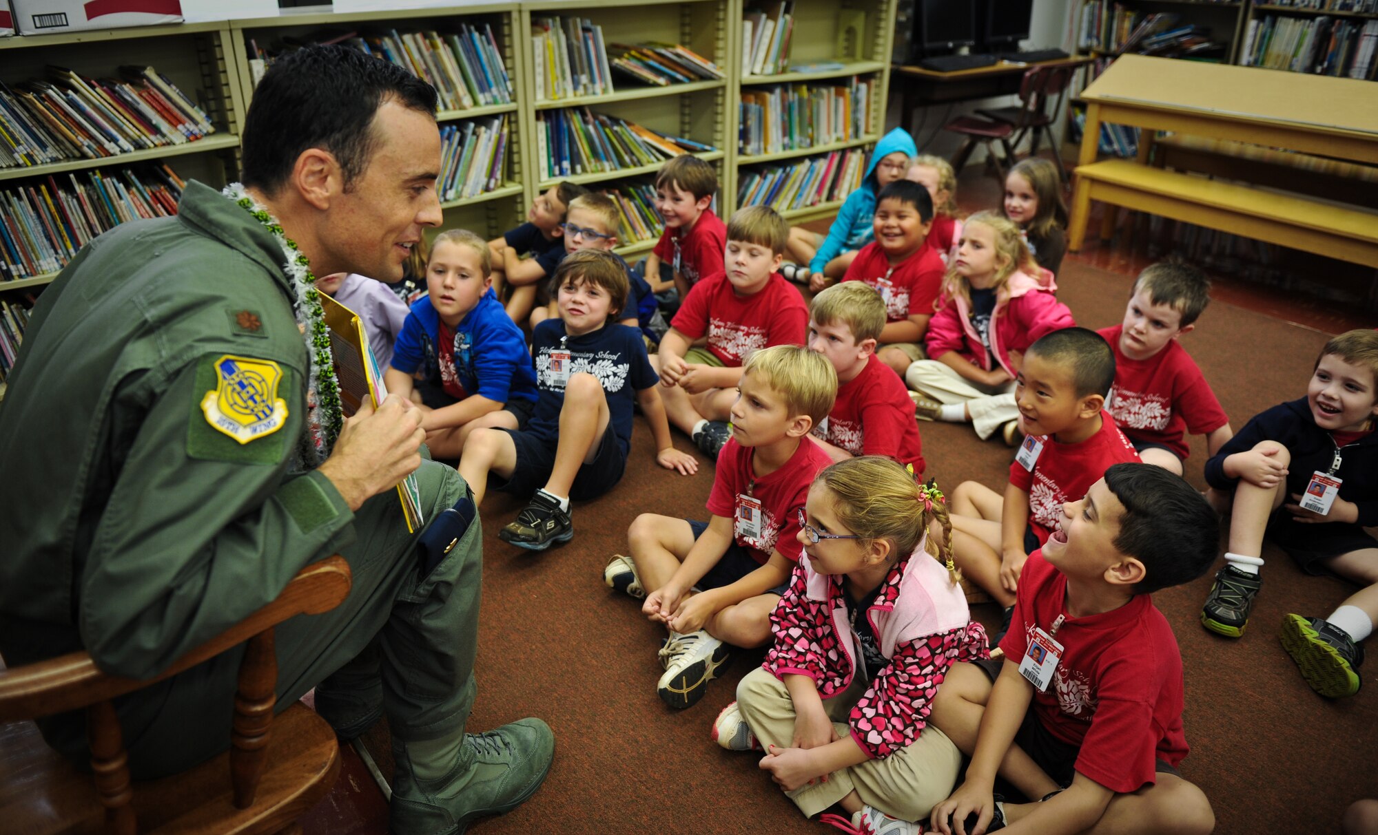 Maj. Lloyd Richardson, a 15th Wing executive officer, reads a Dr. Seuss book to a kindergarden class March 6 at Hickam Elementary on Joint Base Pearl Harbor-Hickam, Hawaii. Richardson read to the children as part of the Read Across America program honoring Dr. Seuss' birthday March 2. (U.S. Air Force photo/Senior Airman Lauren Main)