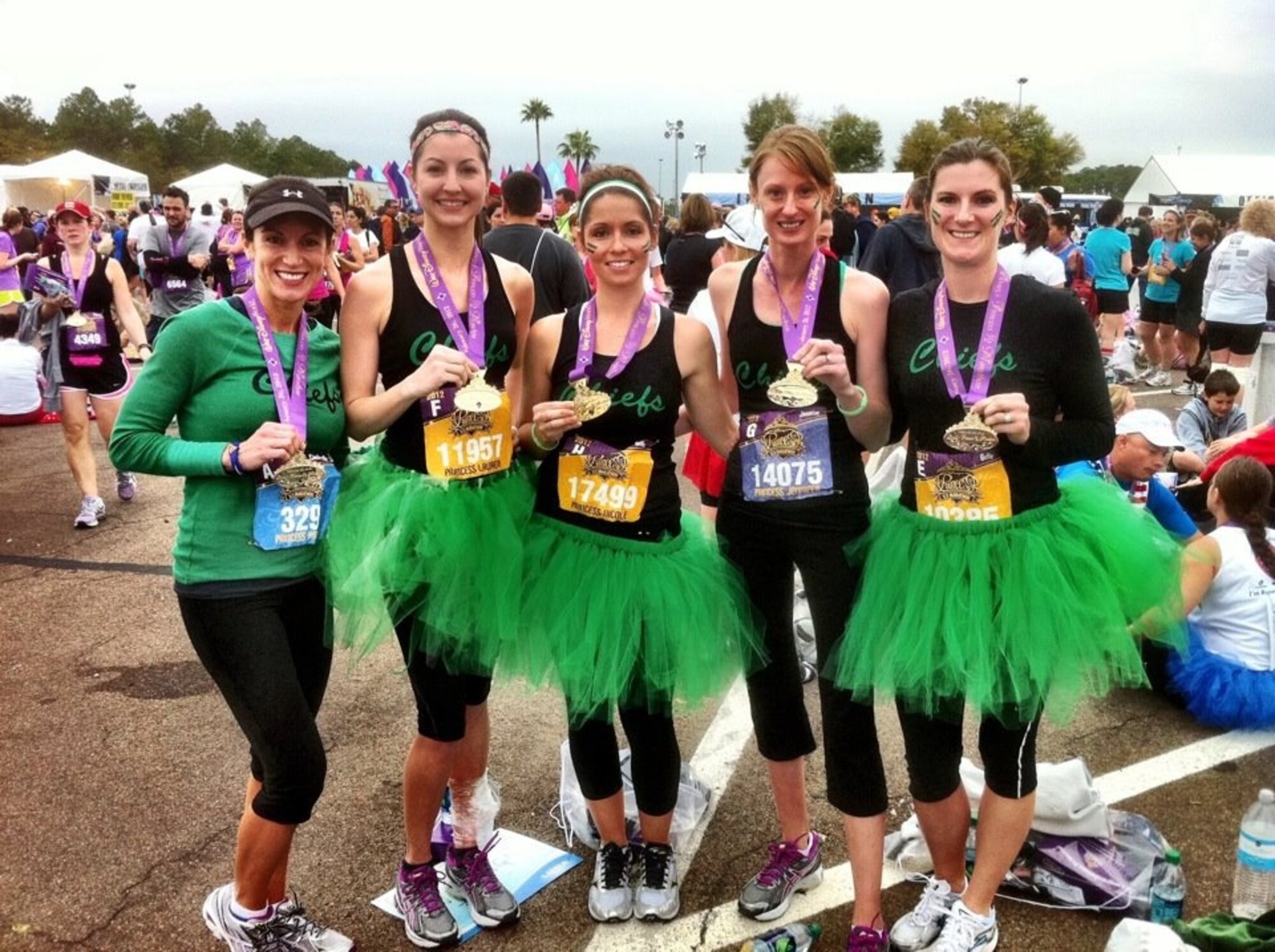 Spouses of Airmen deployed from the 335th Fighter Squadron at Seymour Johnson Air Force Base, N.C., pose for a photo after completing the Disney Princess Half-Marathon in Orlando, Fla., March 26, 2012. The spouses represented their husbands, who are currently deployed in support of Operation Enduring Freedom, in the race by wearing the unit’s color’s and logo during the run. (Courtesy photo)