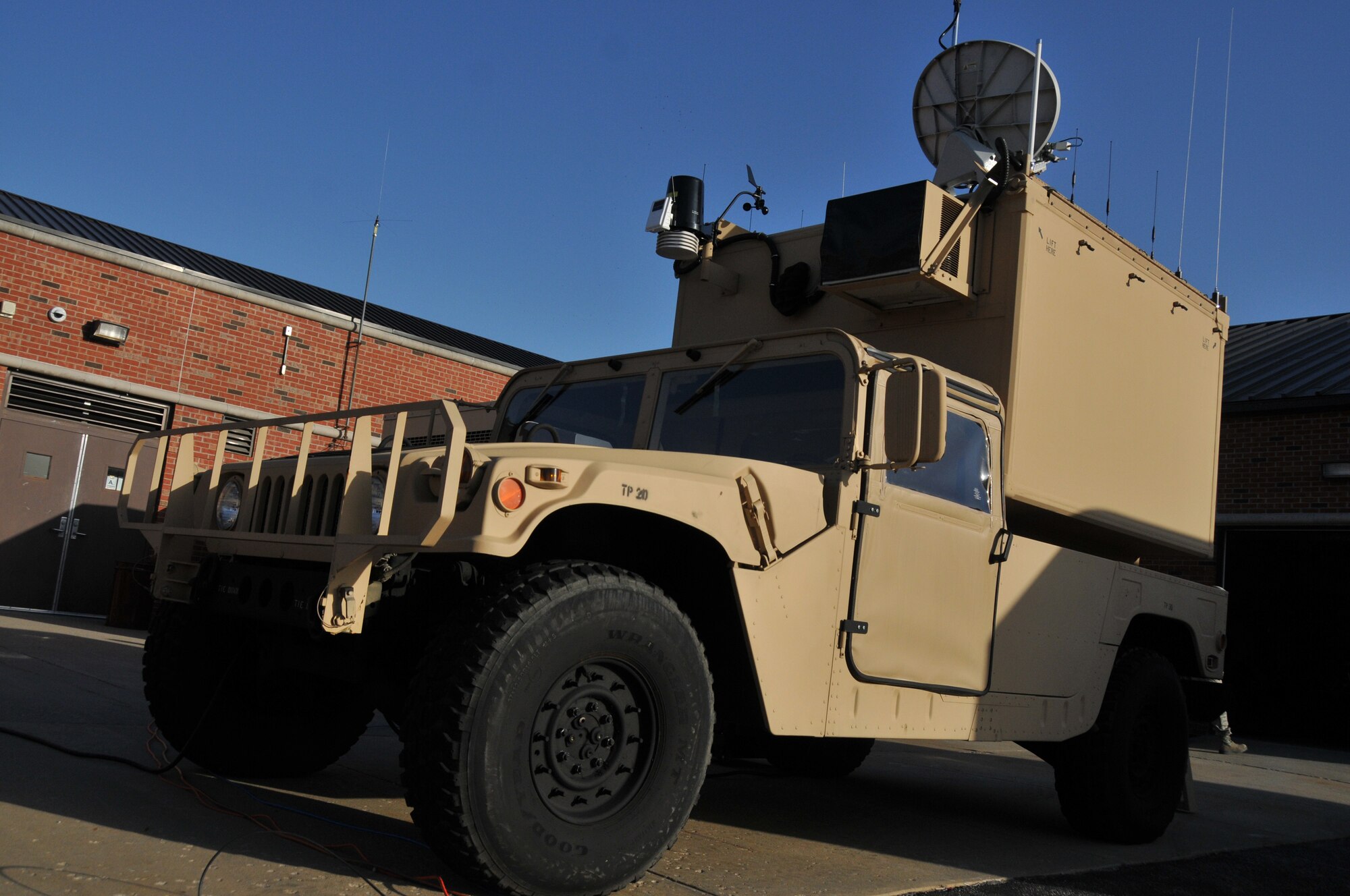 A vehicle mounted Contingency Response Communications System (CRCS) sits operational behind the 126th Communications Flight on March 1, 2012. The CRCS is an internet based solution that allows first responders to communicate and exchange information by radio, live streaming video, wireless internet, and voice over IP services. It provides highly mobile critical communications services to local, state and federal first responders with a simple to operate solution that bridges the gap between first responder agencies and various levels of command and control.The CRCS is a rapidly deployable asset that requires only two personnel and can be operational within 30 minutes of arriving on site. The 126th Air Refueling Wing, Illinois Air National Guard, can provide communications as well as other vital services in the aftermath of a natural disaster or other emergency. (National Guard photo by Master Sgt. Ken Stephens)