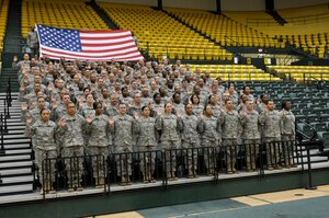 A group of 120 Soldiers assigned to the 10th Transportation Battalion reenlisted March 1 at the College of William and Mary before fellow Soldiers, family members and friends. Col. Steve Cherry, 7th Sustainment Brigade commander, administered the oath of reenlistment. (U.S. Army Photo by Sgt. 1st Class Kelly Jo Bridgwater/ Released)