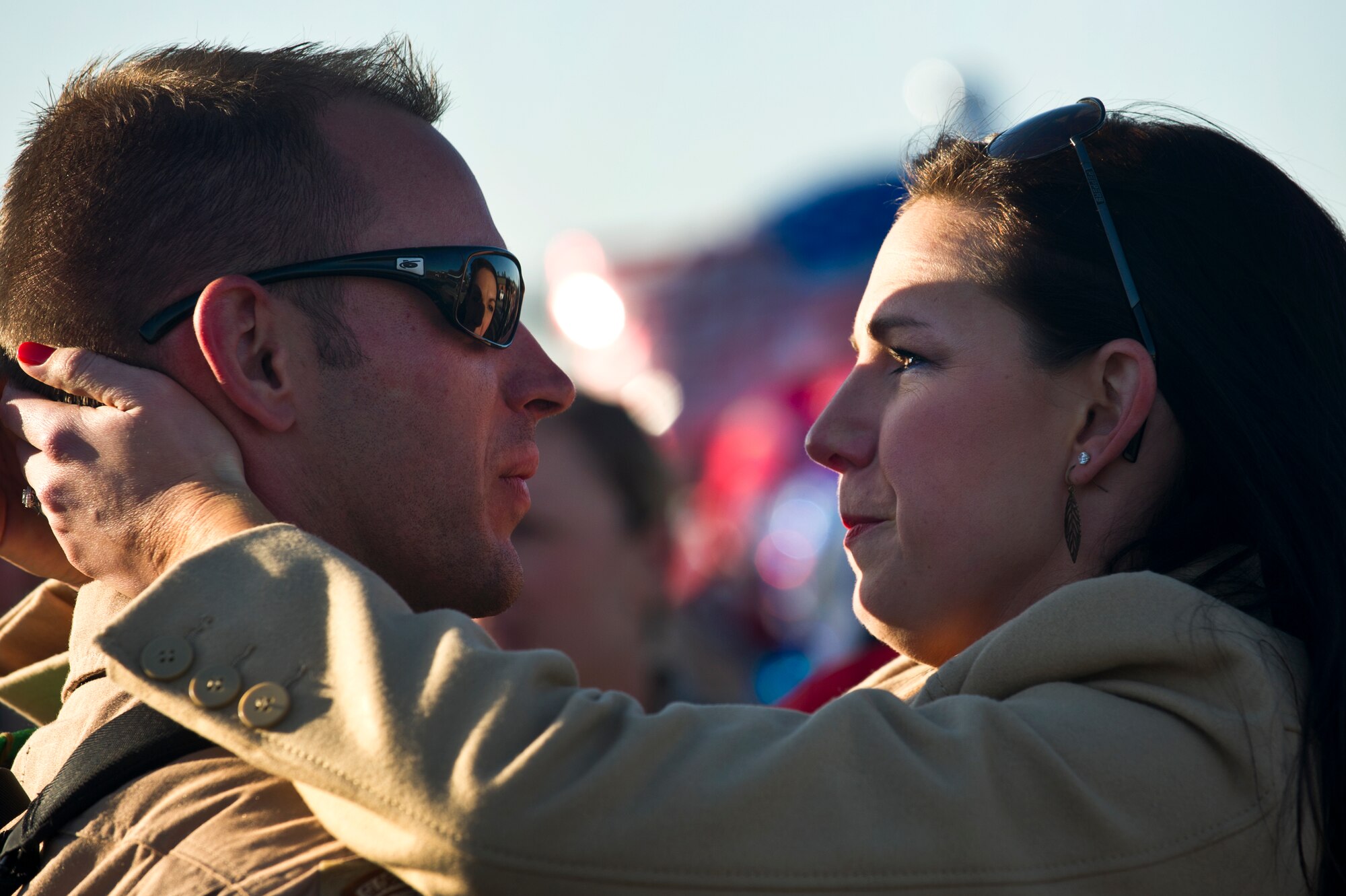Capt. Frank Cope hugs his wife Adriane outside the Joint Base Charleston Passenger Terminal after returning from deployment March 6. More than 130 Airmen from 15th Airlift Squadron, 437th Airlift Wing, returned home from their 120-day deployment to Southwest Asia to reunite with thier family and friends. Cope is a 15th AS C-17A readiness officer. (U.S. Air Force Photo / Airman 1st Class George Goslin)