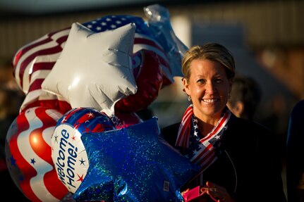 Lisa Rahn, wife of Lt. Col. Curtis Rahn, waits outside the Joint Base Charleston Passenger Terminal for the return of the 15th Airlift Squadron, 437th Airlift Wing March 6. More than 130 Airmen from the 15th AS returned home from their 120-day deployment to Southwest Asia to reunite with their family and friends. Lt. Col. Rahn is the 15th AS assistant flight commander. (U.S. Air Force Photo / Airman 1st Class George Goslin)