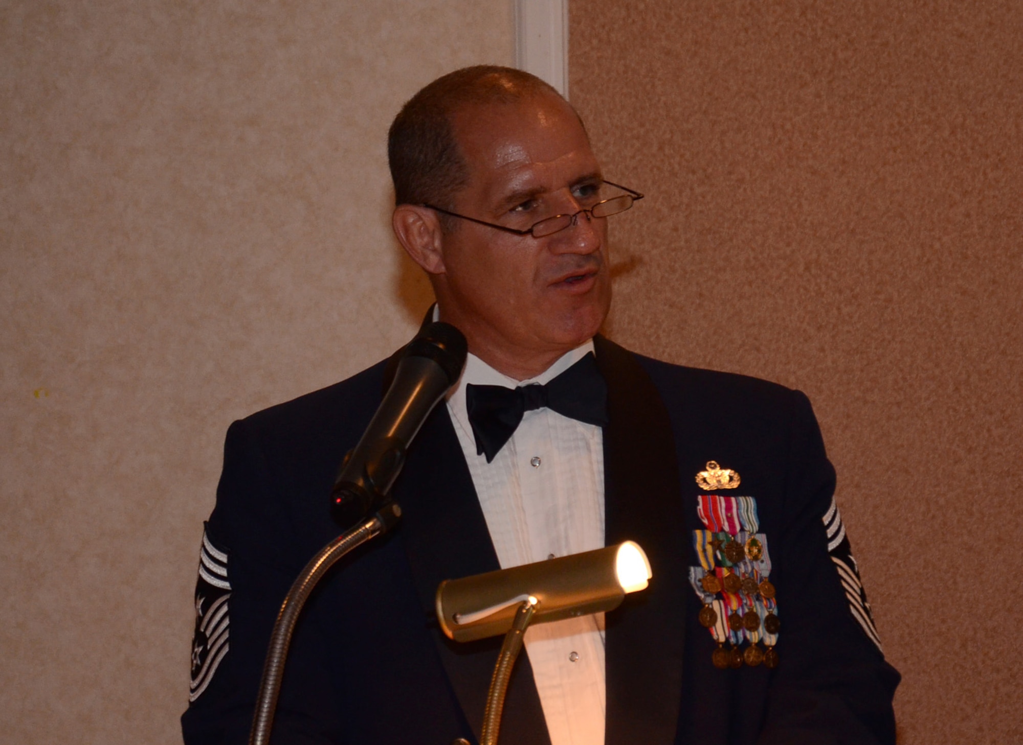 Chief Master Sgt. Gerald Delebreau, 920th Rescue Wing command chief, Patrick Air Force Base, Fla., reads the responsibilities with which chiefs are charged to four newly-pinned chief master sergeants and two chief selects at the Chief's Recognition Ceremony March 3, 2012 in Cocoa Beach, Fla. (U.S. Air Force photo/Staff Sgt. Anna-Marie Wyant)