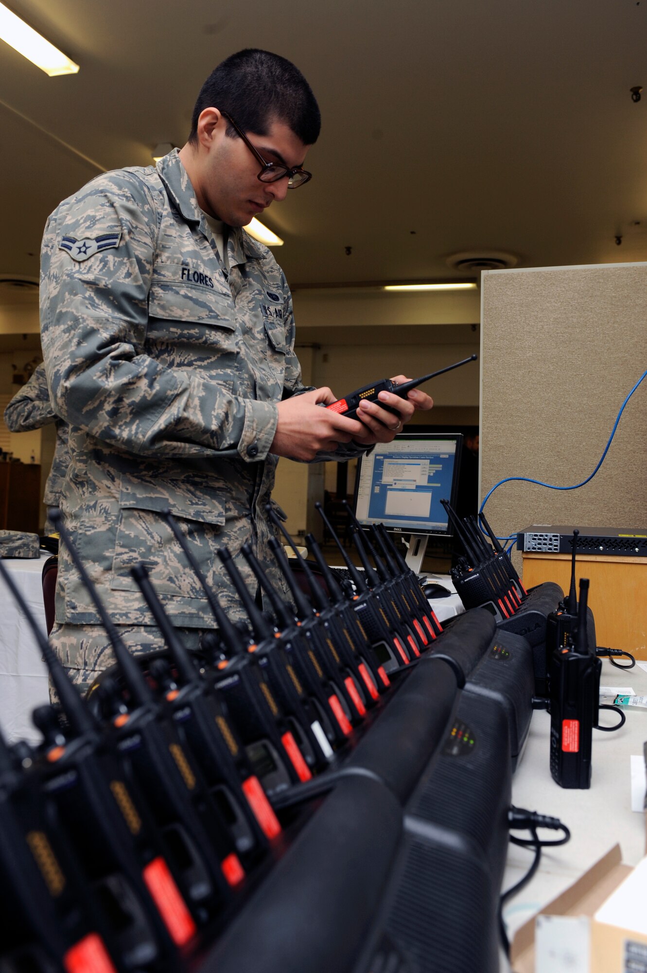 MINOT AIR FORCE BASE, N.D. -- Airman 1st Class Edwin Flores, 5th Communications Squadron client support technician, conducts radio checks to ensure communication equipment is in proper working condition here March 6. Communication is essential for the day-to-day operations of Team Minot organizations. (U.S. Air Force photo/Airman 1st Class Stephanie Ashley)
