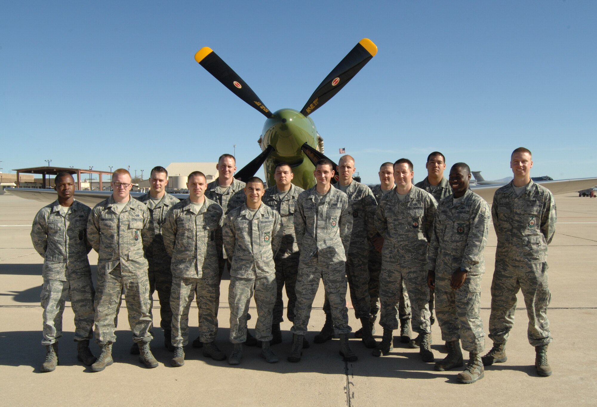 Airmen from the 355th Civil Engineer Squadron fire department pose for a picture after receiving egress training during the Heritage Flight Conference at Davis-Monthan Air Force Base, Ariz., March 1. (U.S. Air Force photo by Airman 1st Class Michael Washburn/Released)
