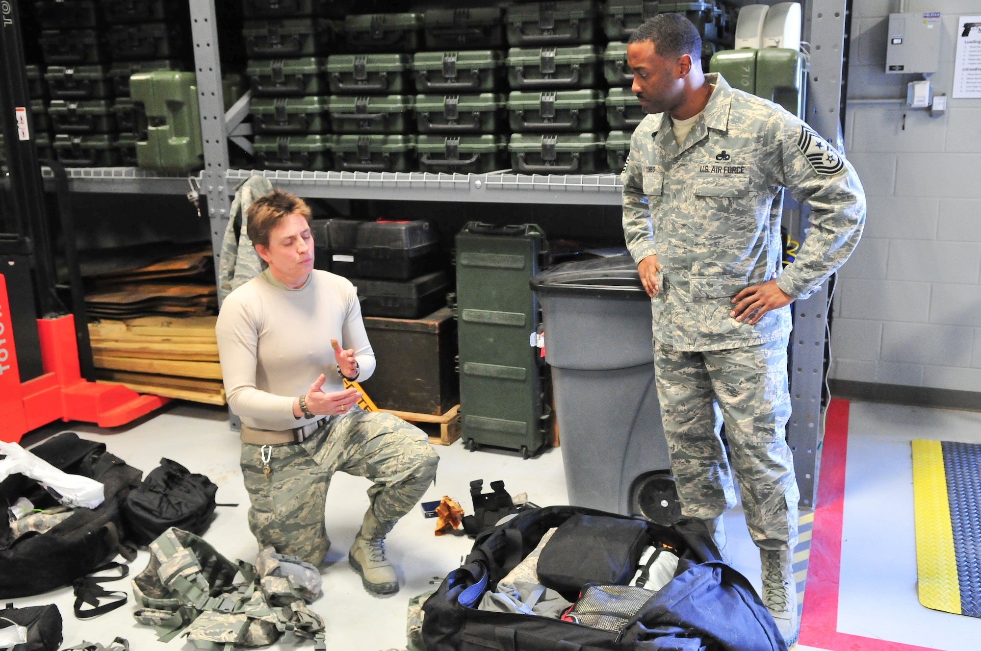 As she packs her deployment bags, Tech. Sgt. Catherine Byrem of the 710th Security Forces Squadron explains to Chief Master Sergeant Elroy Combs Jr., Command Chief Master Sergeant, 10th Air Force, that she'll be participating in "Patriot Defender", a 17-day security forces ground combat skills training exercise at Fort Wolters, Texas, which includes classroom instruction, field exercises and performance evaluations directed by the 610th Security Forces Squadron, Joint Reserve Base, Fort Worth, Texas. (U.S. Air Force photo/Tech. Sgt. Nicholas B. Ontiveros)