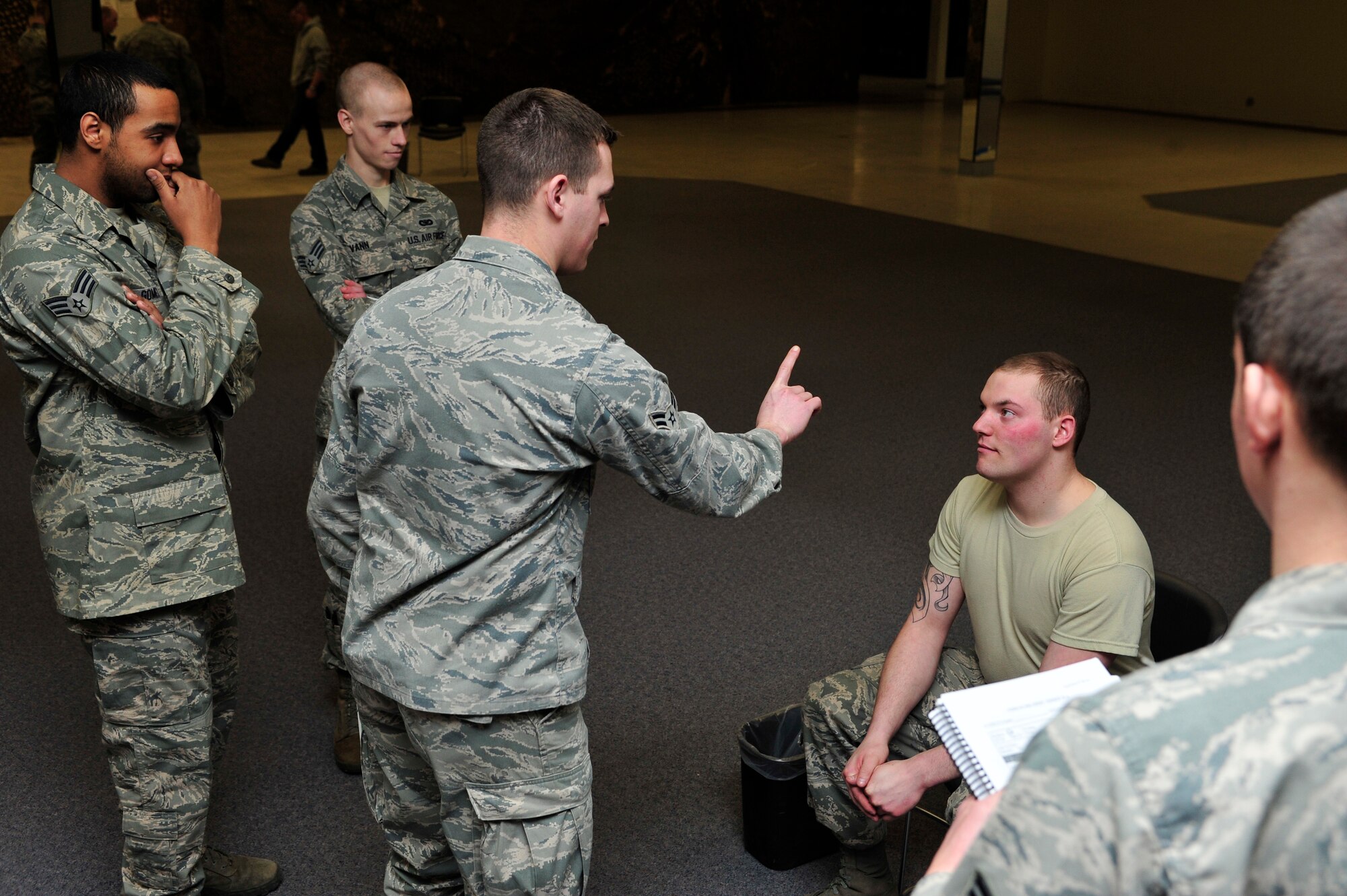 MINOT AIR FORCE BASE, N.D. -- Airman 1st Class Michael Colecchi, 5th Security Forces Squadron response force member, conducts a  Horizontal Gaze Nystagmus test on Airman Kyle Lagrange, 5th Civil Engineer Squadron structural apprentice, during a joint training session alongside the Minot Police Department here Feb. 29. The 5th SFS came together with downtown law enforcement to conduct a two-day training course that gave them the necessary training and certification to help identify possible drivers under the influence of alcohol. (U.S. Air Force photo/Senior Airman Desiree Esposito)

 
