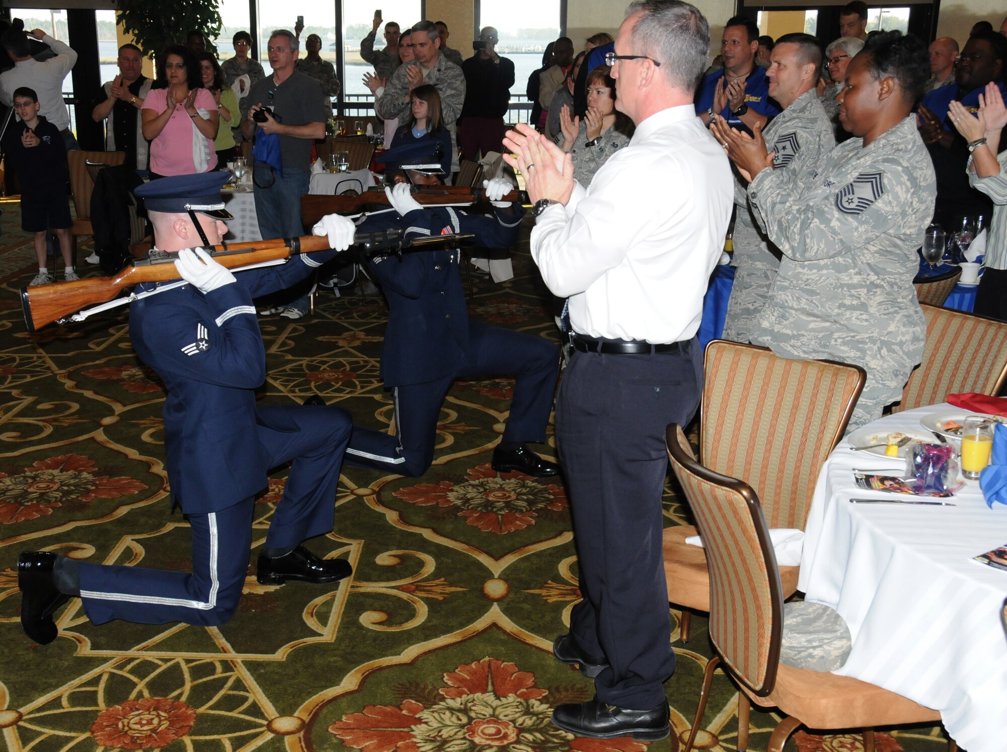 The United States Air Force Drill Team did a four-man drill performance during the National Prayer Breakfast ceremony March 6, 2012, at the Bay Breeze Event Center, Keesler Air Force Base, Miss.  (U.S. Air Force photo by Kemberly Groue)