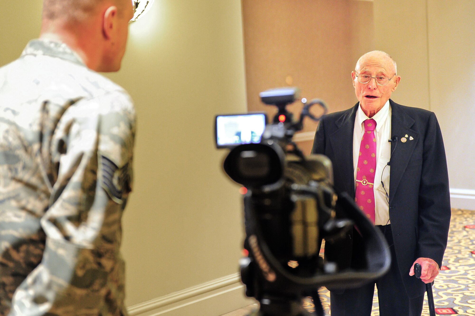 Mr. Marion Hall takes time out to give an interview to Tech. Sgt. Jeffrey Fitzmorris, public affairs videographer, 310th Space Wing, during the 310th SW annual awards banquet on March 2, 2012 at the Antlers Hilton in Colorado Springs, Colo. Mr. Hall answered questions about his service in the 380th bombardment squadron, 310th bombardment group, in 1942, right after the group was activated. Mr. Hall held the rank of sergeant as a B-25 aircraft mechanic. (U.S. Air Force photo/Tech. Sgt. Nicholas B. Ontiveros)
