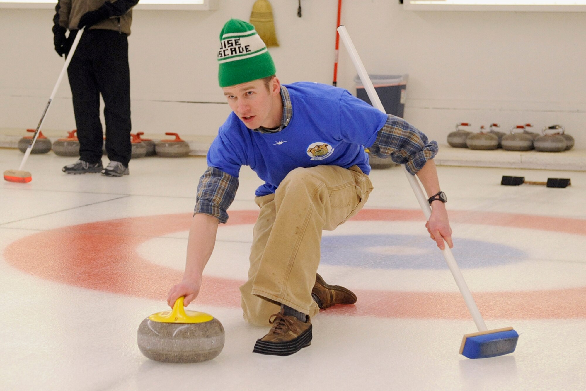 Capt. Brett Vongroven, 525th Fighter Squadron, launches a shot in the championship game of 3rd Wing's curling competition March 2 at the Anchorage Curling Club.  The 525th went into the championship game undefeated, but lost two games to the 962nd AACS to finish as runners up. (U.S. Air Force photo/John Pennell)