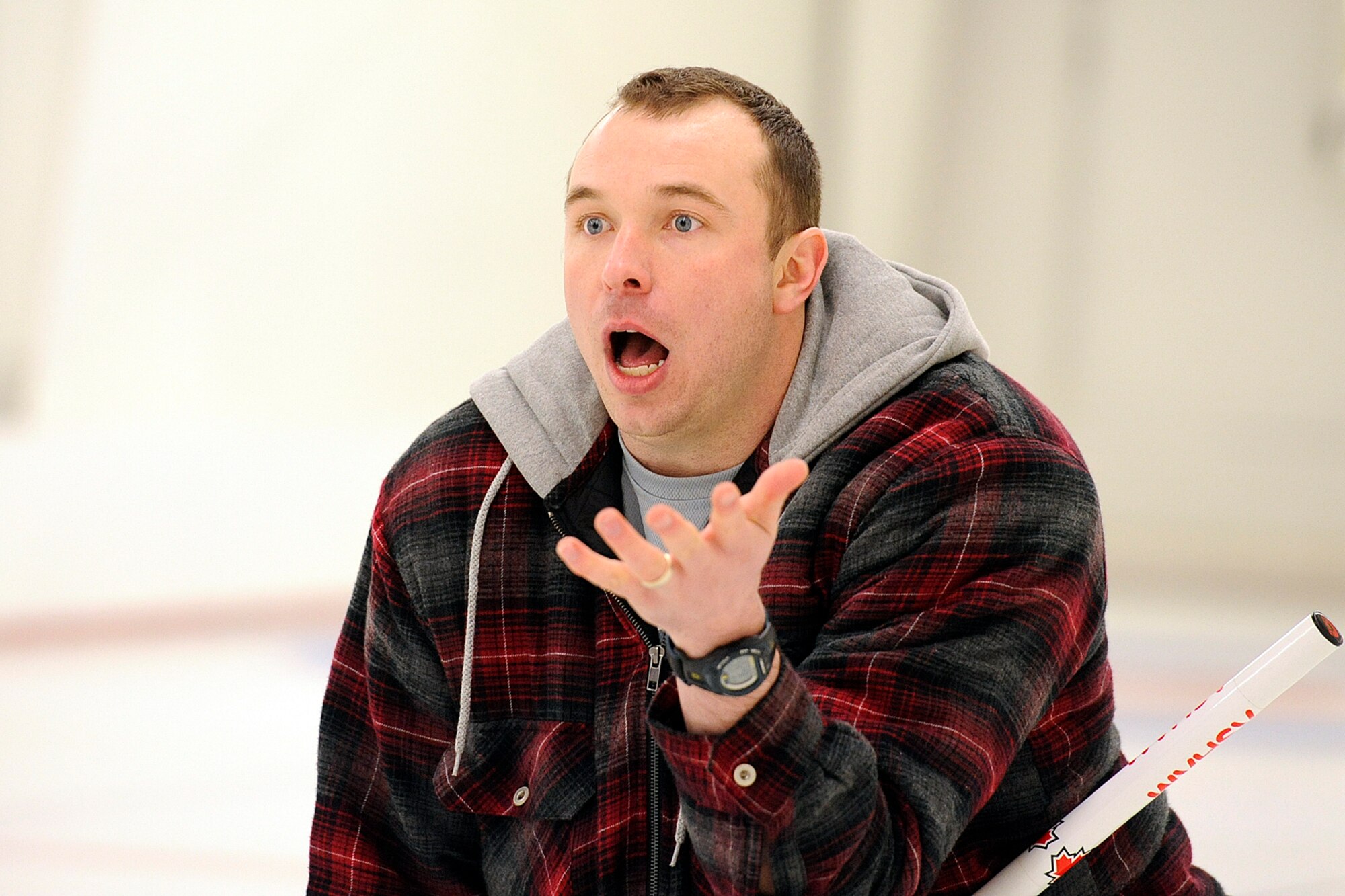 Royal Canadian Air Force Capt. Dave Foyers, 962nd Airborne Air Control Squadron, reacts to his shot placement during the 3rd Wing curling competition at the Anchorage Curling Club March 2. (U.S. Air Force photo/John Pennell)