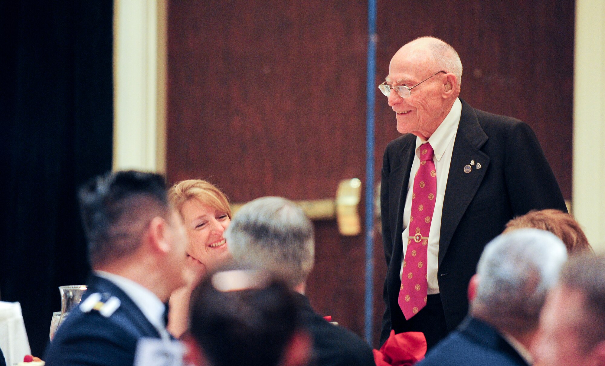 Special guest Mr. Marion Hall stands as he was introduced and recognized during the 310th Space Wing awards banquet on March 2, 2012 at the Antlers Hilton in Colorado Springs, Colo. for his service in the 380th bombardment squadron, 310th bombardment group, in 1942, right after the group was activated. Mr. Hall held the rank of sergeant as a B-25 aircraft mechanic. (U.S. Air Force photo/Tech. Sgt. Nicholas B. Ontiveros)