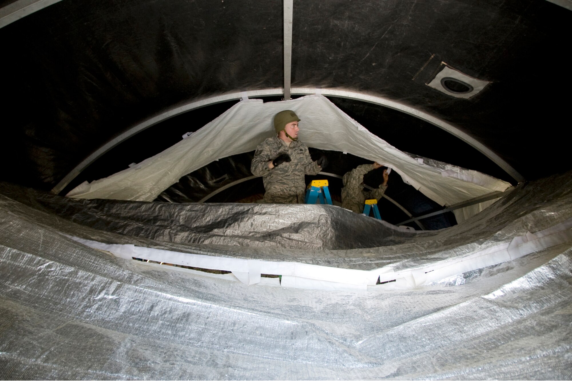 Tech. Sgt. Aaron Alden attaches the insulating liner of the SSS structure during the Silver Flag exercise.  Airmen from the 148th Fighter Wing Force Support Squadron participated in a weeklong contingency operations training exercise from February 18-25 at Dobbins Air Reserve Base.  (U.S. Air Force photo by Staff Sgt. Paul Santikko)

http://www.minnesotanationalguard.org/press_room/e-zine/articles/index.php?item=3688