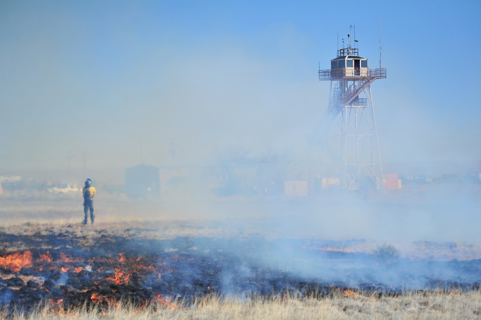 A section of Melrose Air Force Range is set fire for a controlled burn, March 5, 2012. Controlled burns are used to deprive wild fires of fuel and to prevent them from spreading. Melrose Range provides a space for realistic training of ground and air forces and is operated by Cannon Air Force Base, N.M. (U.S. Air Force photo by Tech. Sgt. Josef Cole)