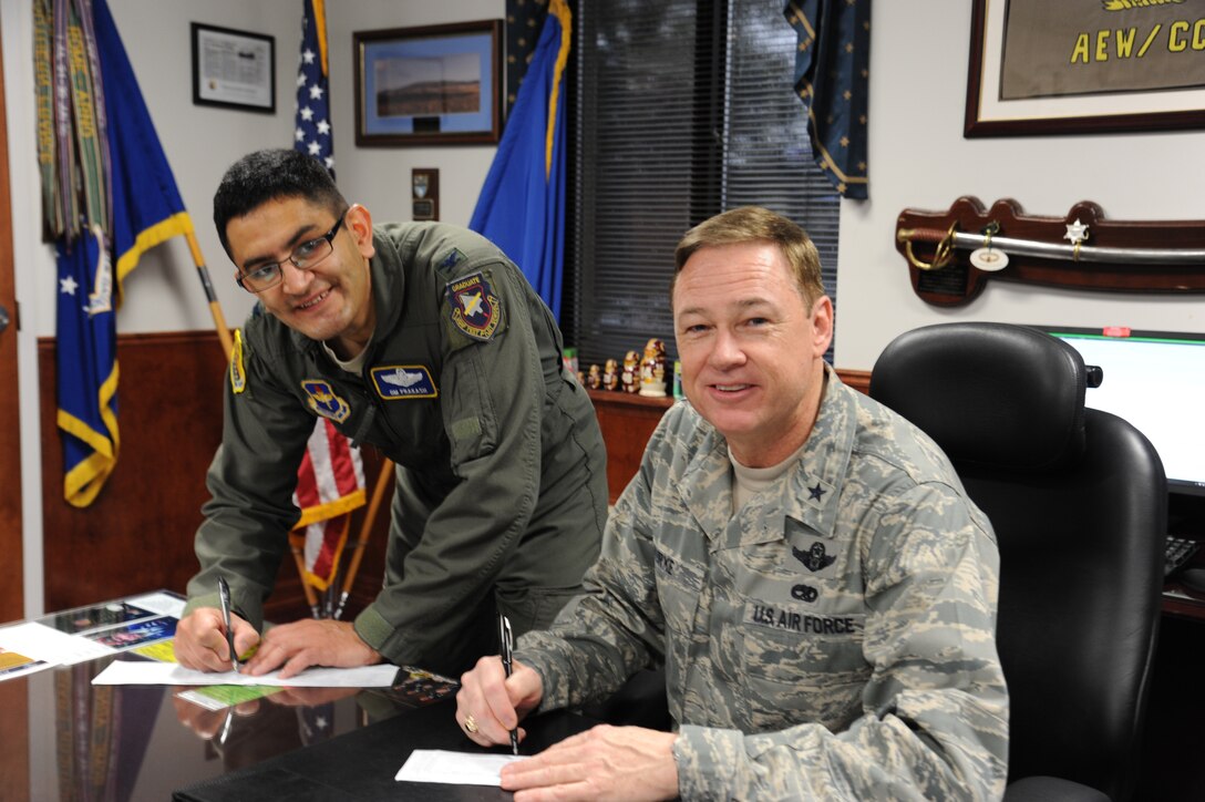 Brig. Gen. Darryl Burke, 82nd Training Wing commander, and Col. Om Prakash, 82nd TRW vice commander, fill out their AFAF contribution forms March 8, 2012. The Air Force Assistance Fund campaign at kicked off Feb. 27 and will last through April 6, with a base-wide goal this year of $82,056. Last year Sheppard Air Force Base, Texas, raised 113,611 and received $147,582 in AFAF loans and grants which helped 244 Sheppard Airmen.  (U.S. Air Force photo/Senior Airman Adawn Kelsey)